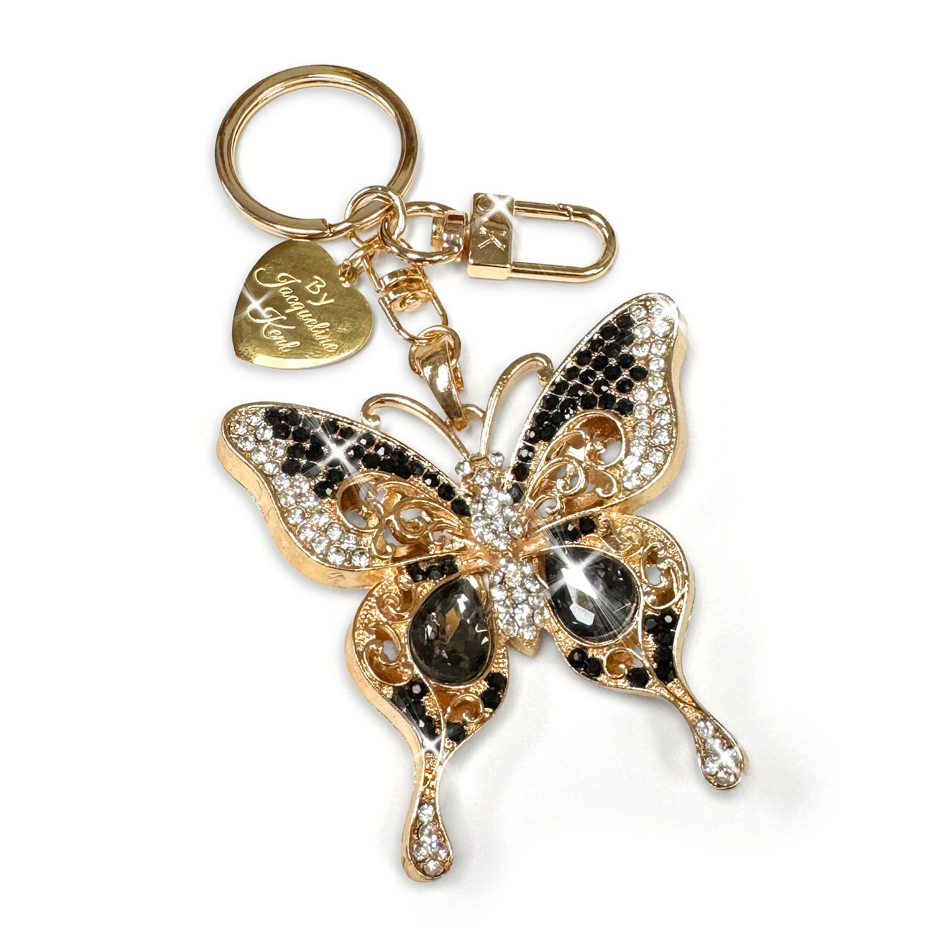 Butterfly keychain with gold and black crystals design on a white background