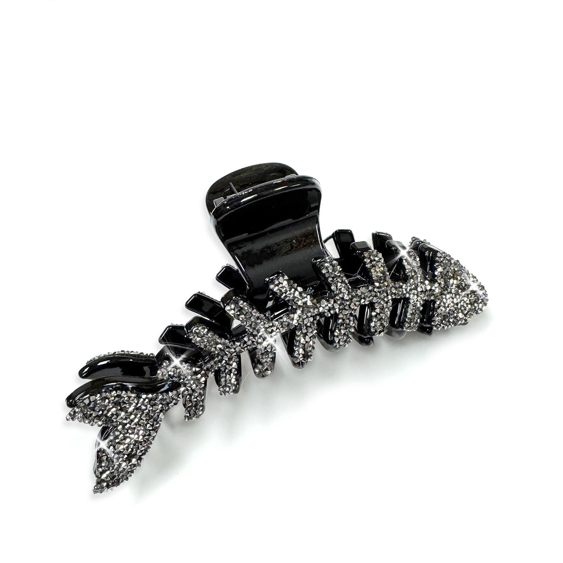 Black and hematite crystal fish bone hair clip on a white background