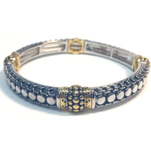 Bracelet with silver and gold design on a white background