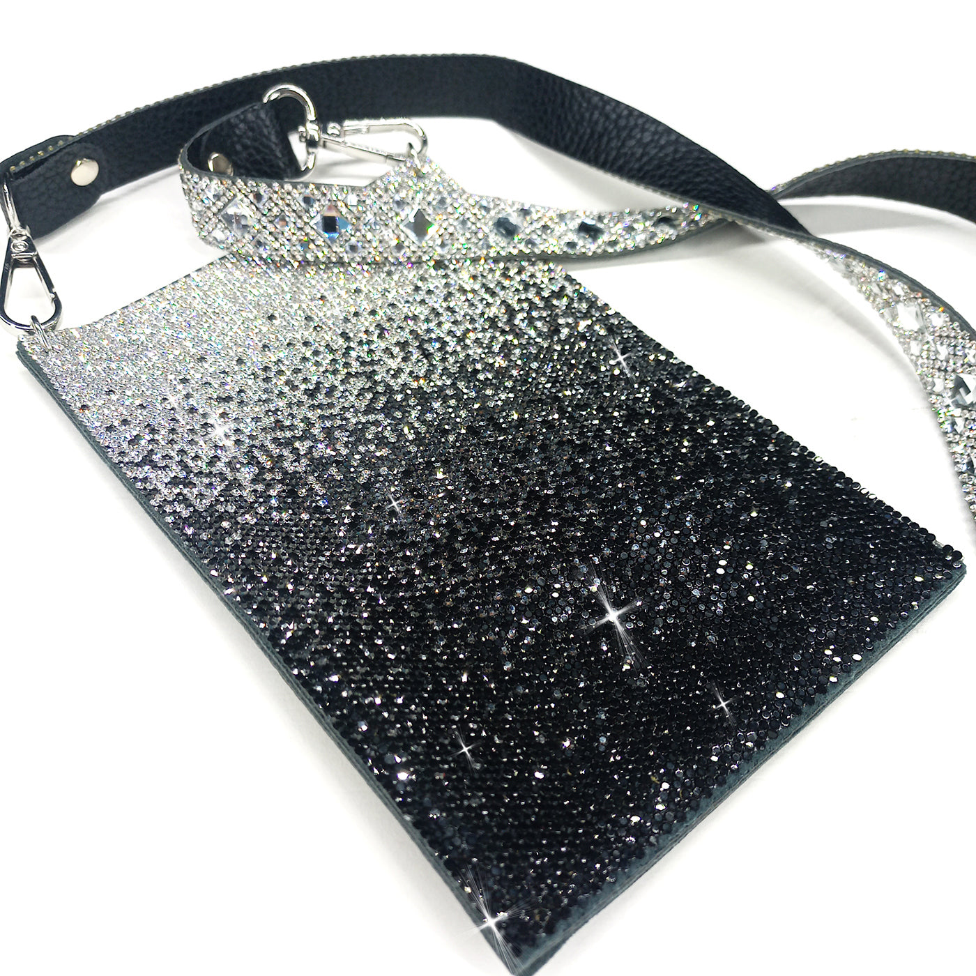 Glittery black and silver ombre cellphone crossbody bag on a white background