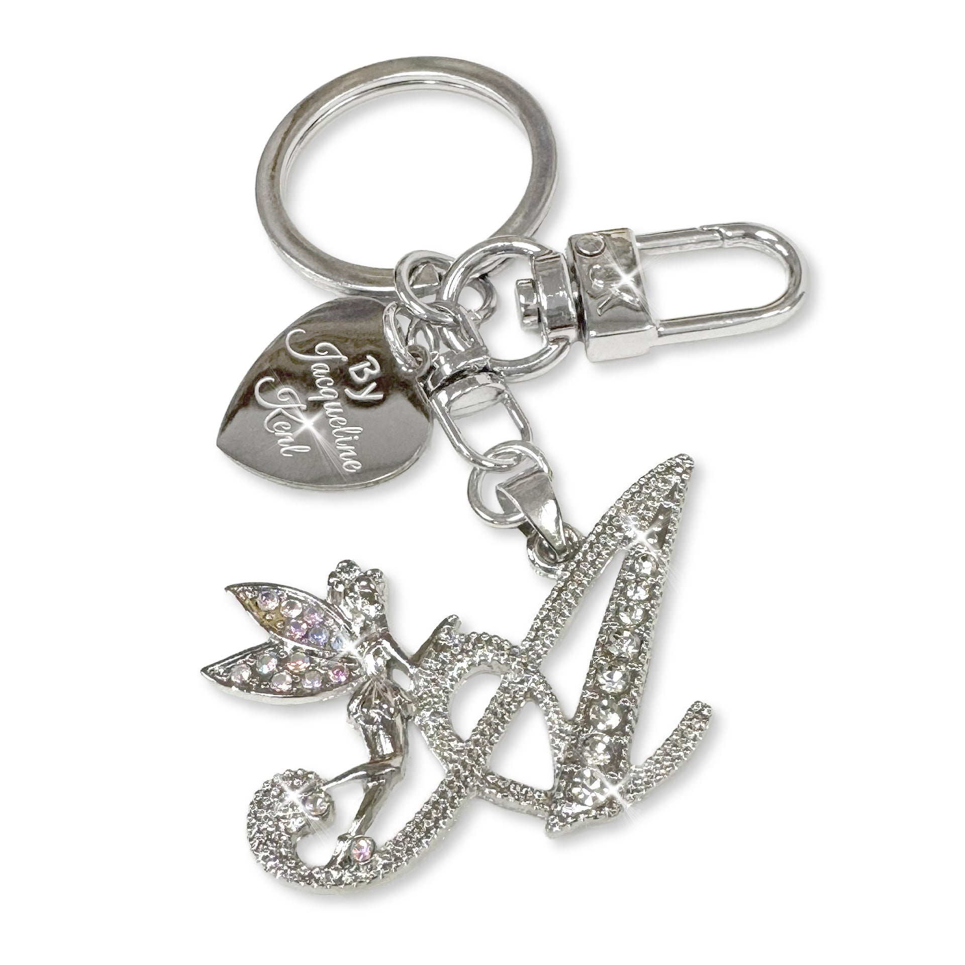 Silver and crystal embellished keychain with decorative letter 'A' and heart-shaped Jacqueline Kent branded tag on a white background
