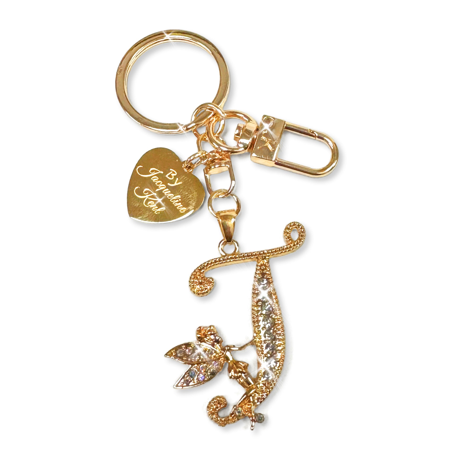 Gold and crystal embellished keychain with decorative letter 'Z' and heart-shaped Jacqueline Kent branded tag on a white background