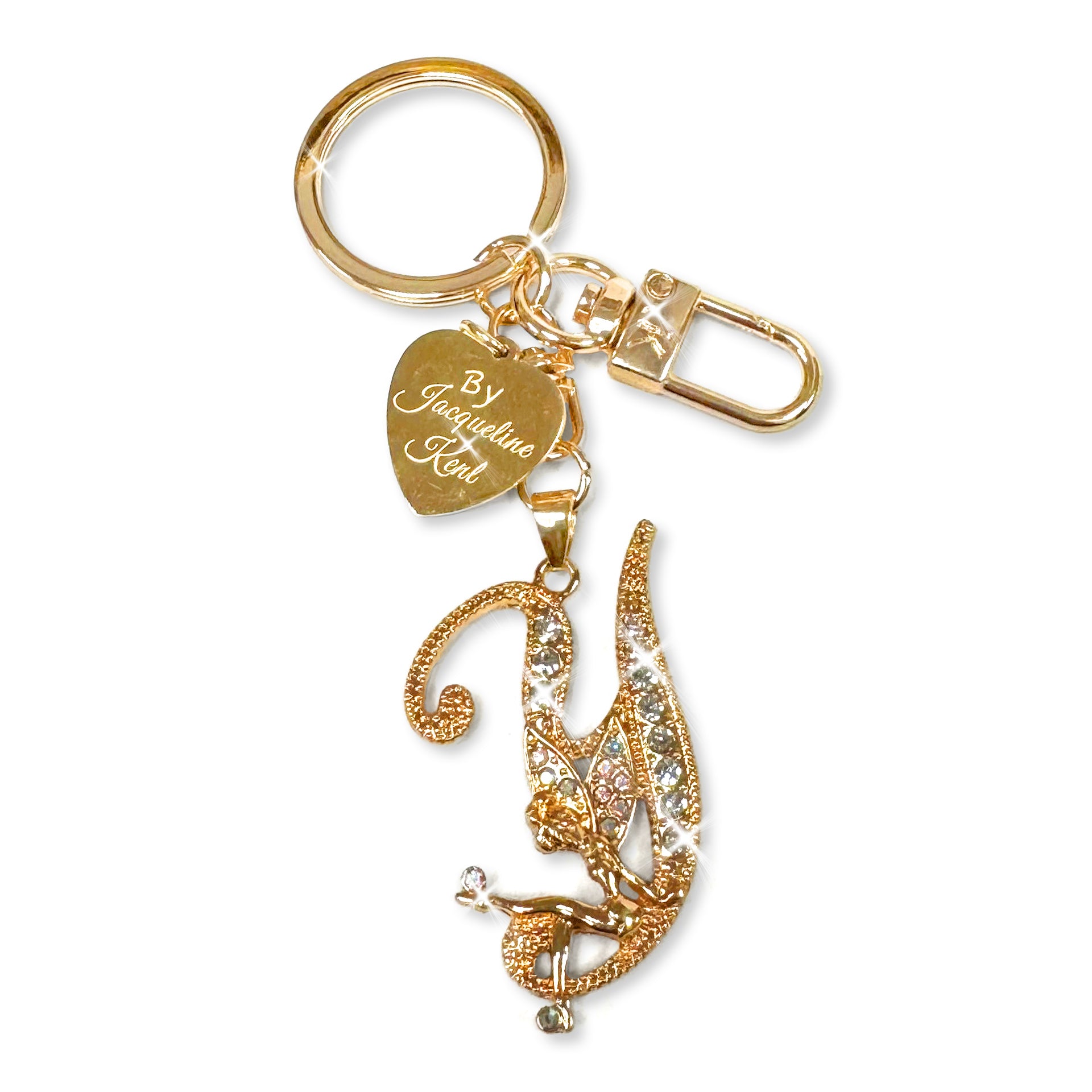 Gold and crystal embellished keychain with decorative letter 'Y' and heart-shaped Jacqueline Kent branded tag on a white background