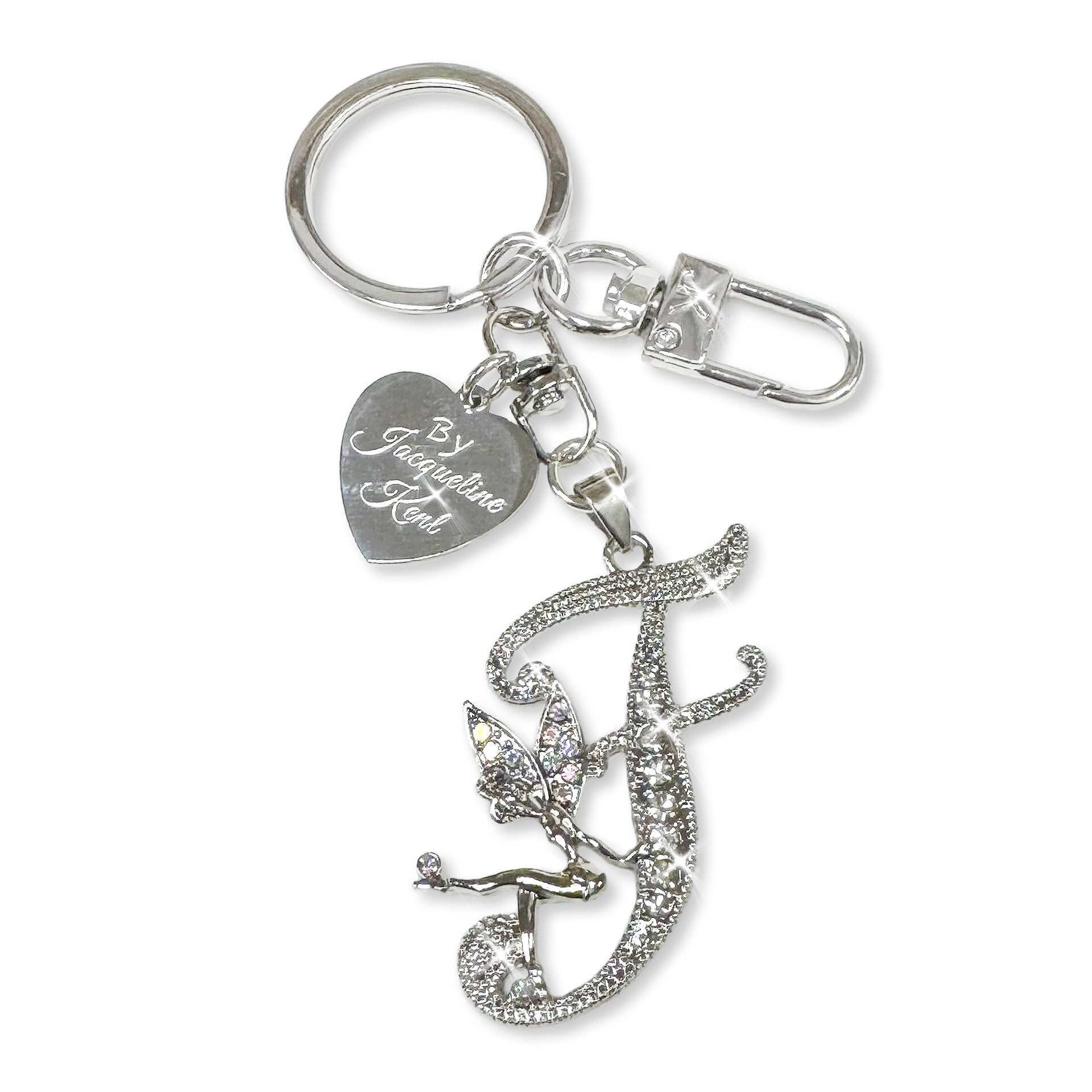 Silver and crystal embellished keychain with decorative letter 'F' and heart-shaped Jacqueline Kent branded tag on a white background