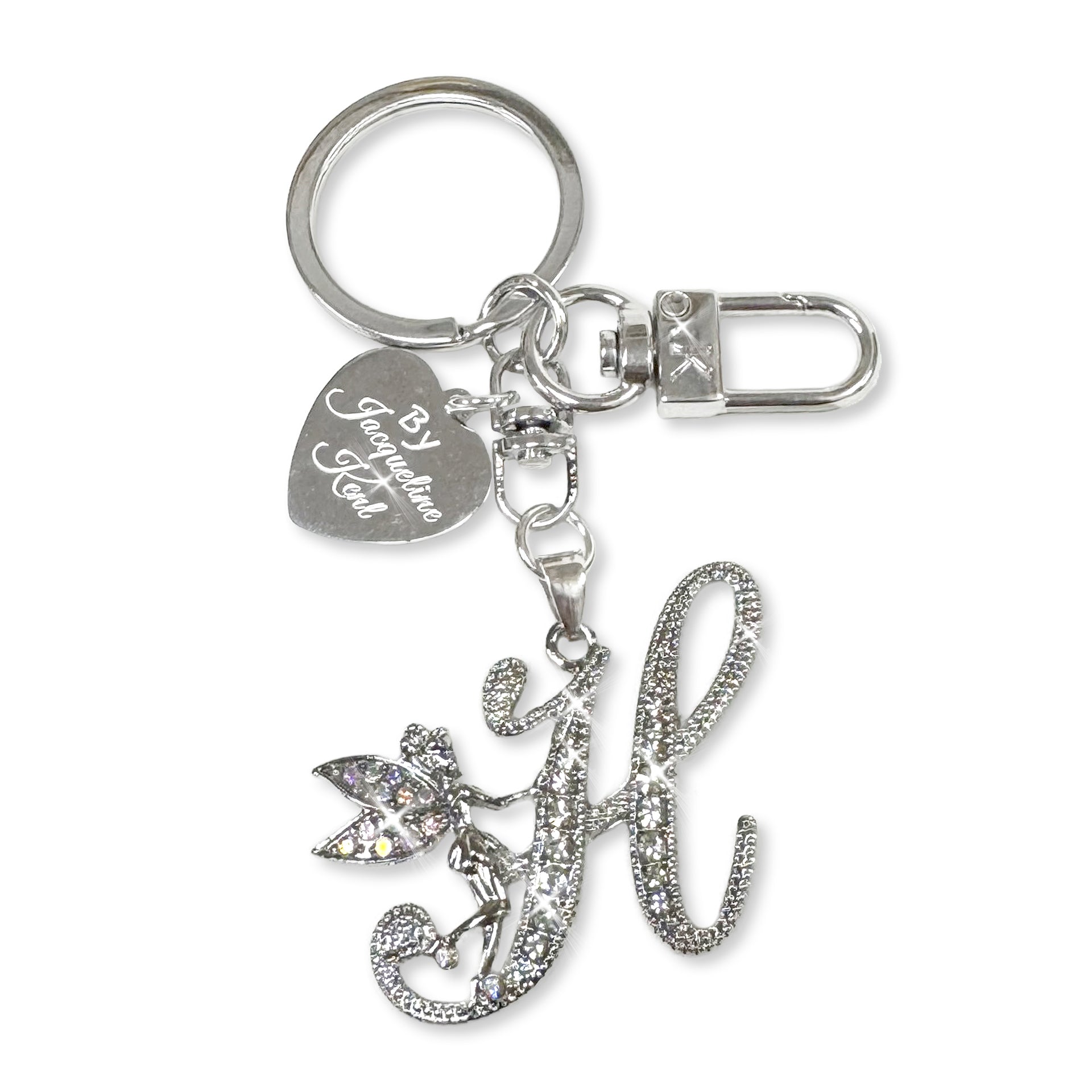 Silver and crystal embellished keychain with decorative letter 'H' and heart-shaped Jacqueline Kent branded tag on a white background