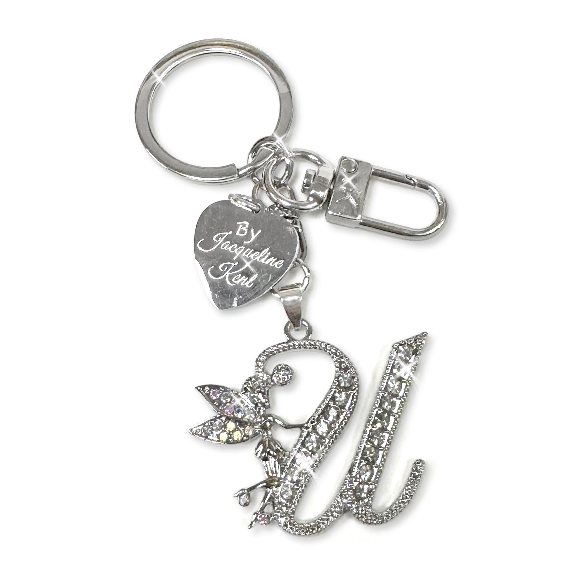 Silver and crystal embellished keychain with decorative letter 'U' and heart-shaped Jacqueline Kent branded tag on a white background