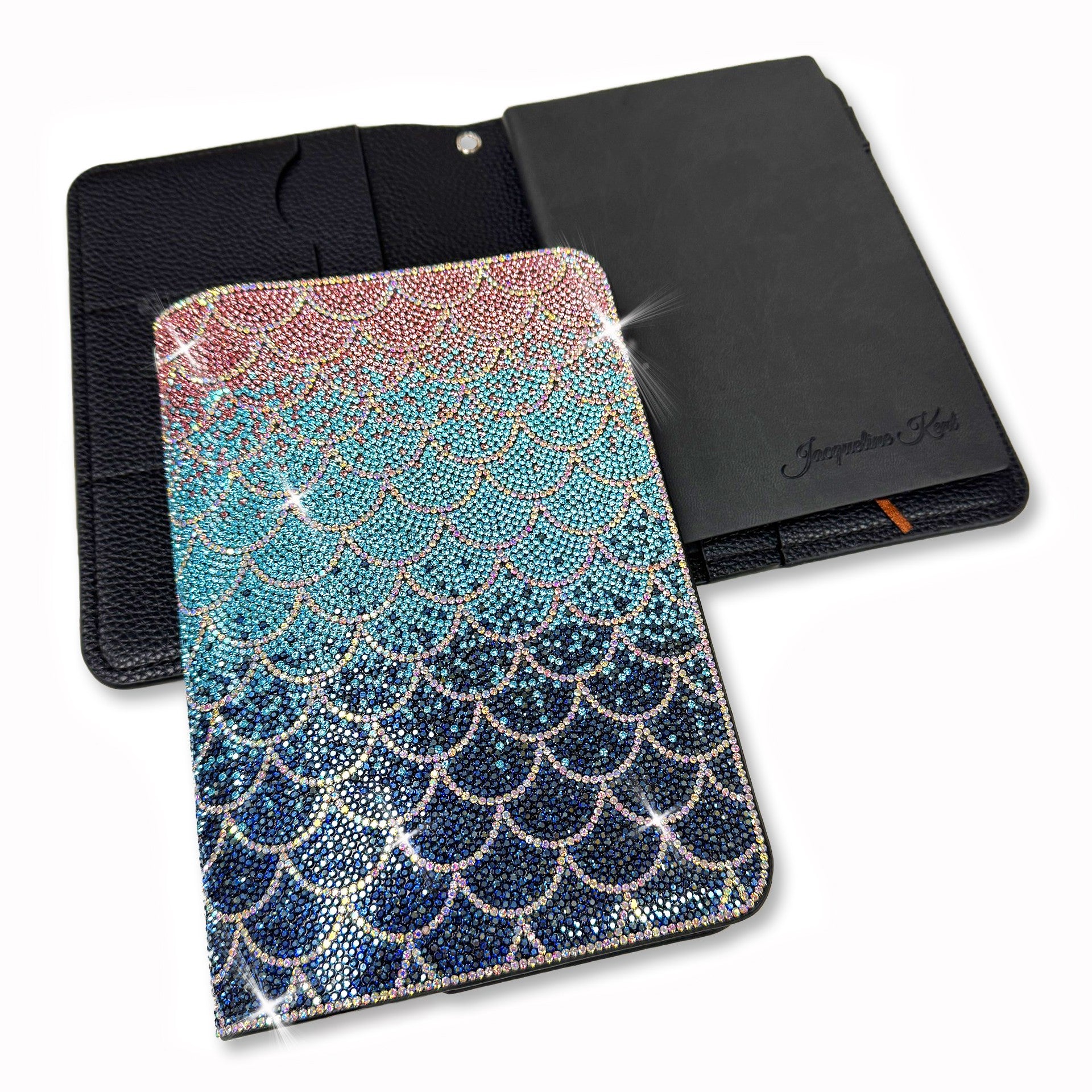 Notebook with rhinestones mermaid scale design on a white background