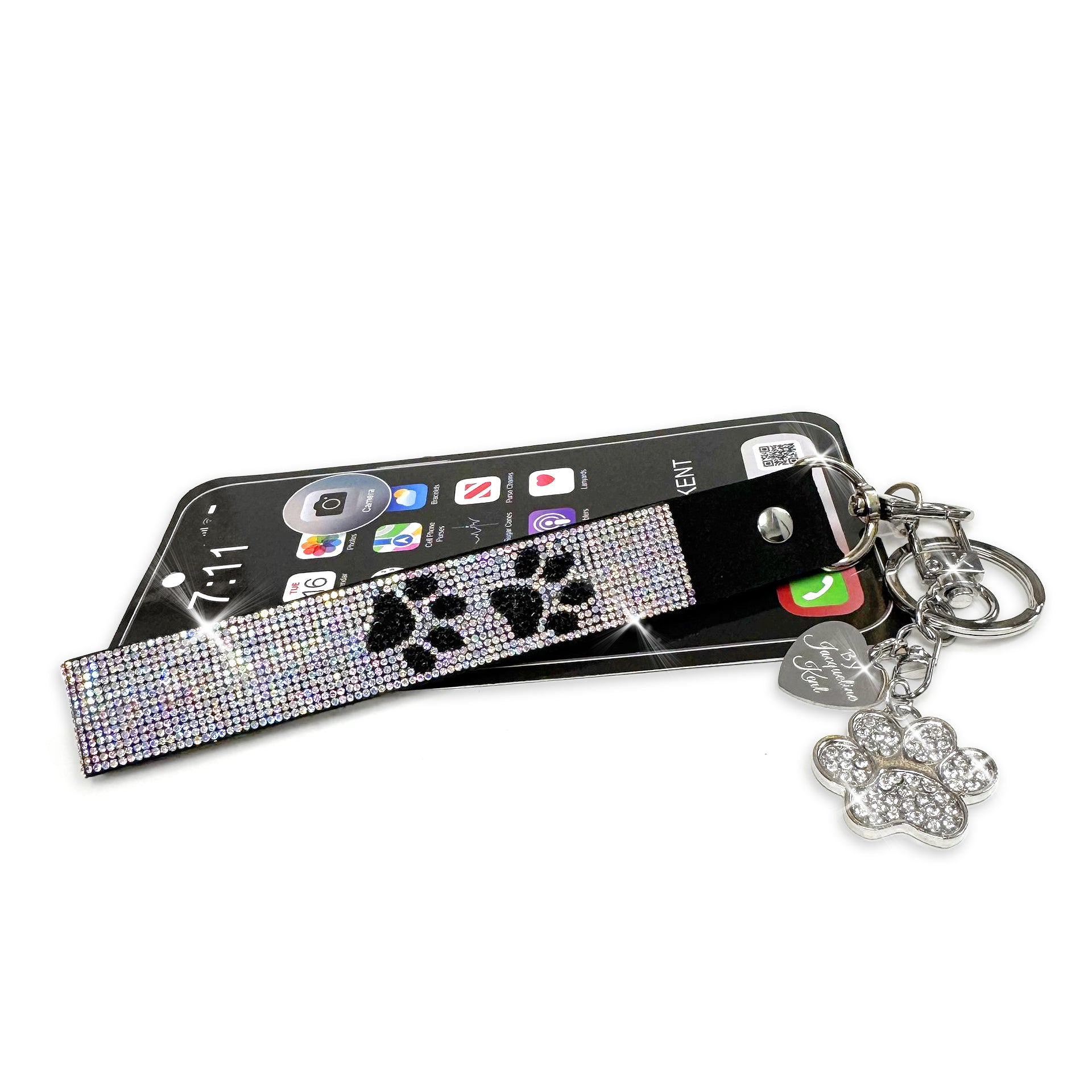 Phone/wrist lanyard with iridescent AB and black rhinestone detailed paw print design and keychain on a white background