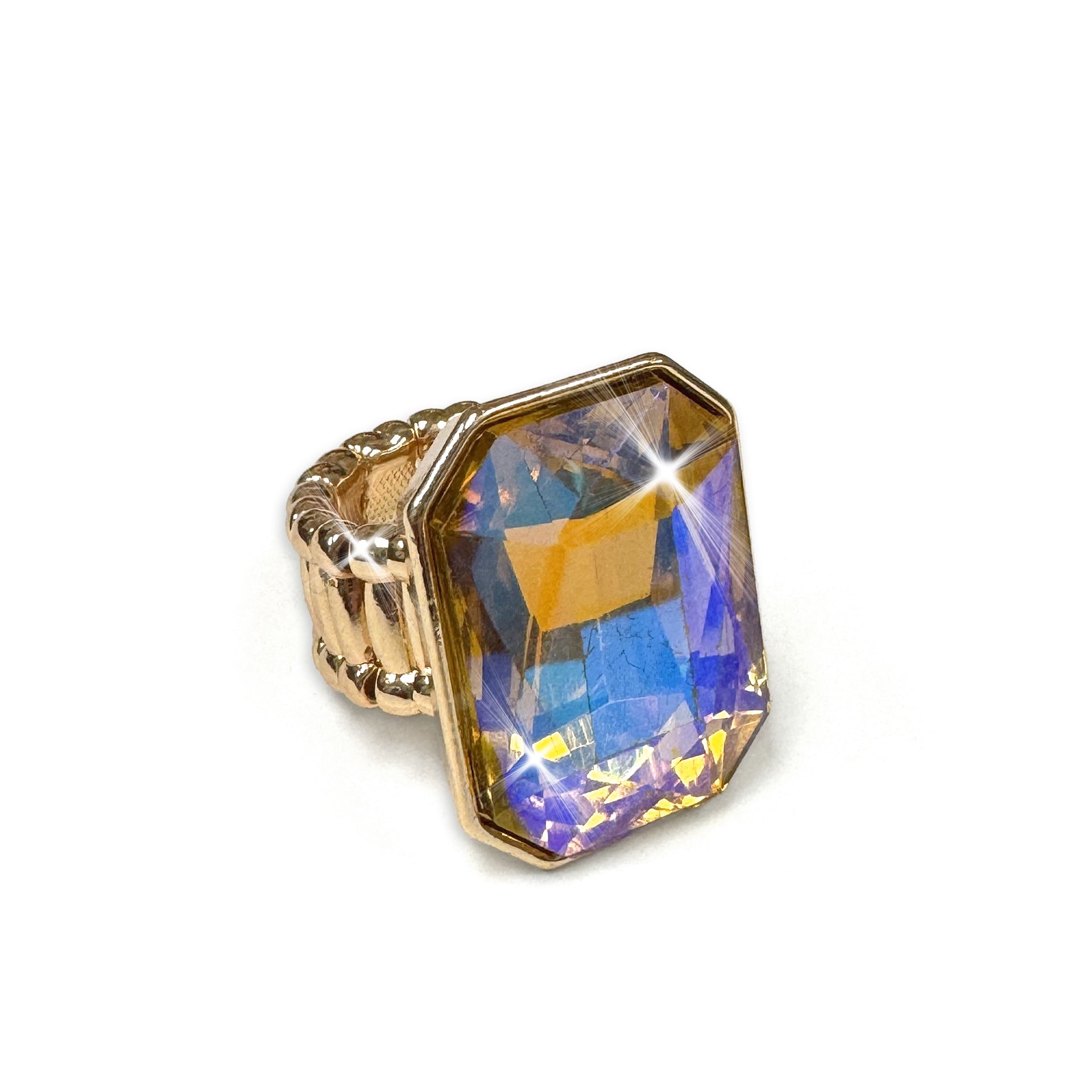 Gold ring with a large, faceted, multicolored gemstone on a white background