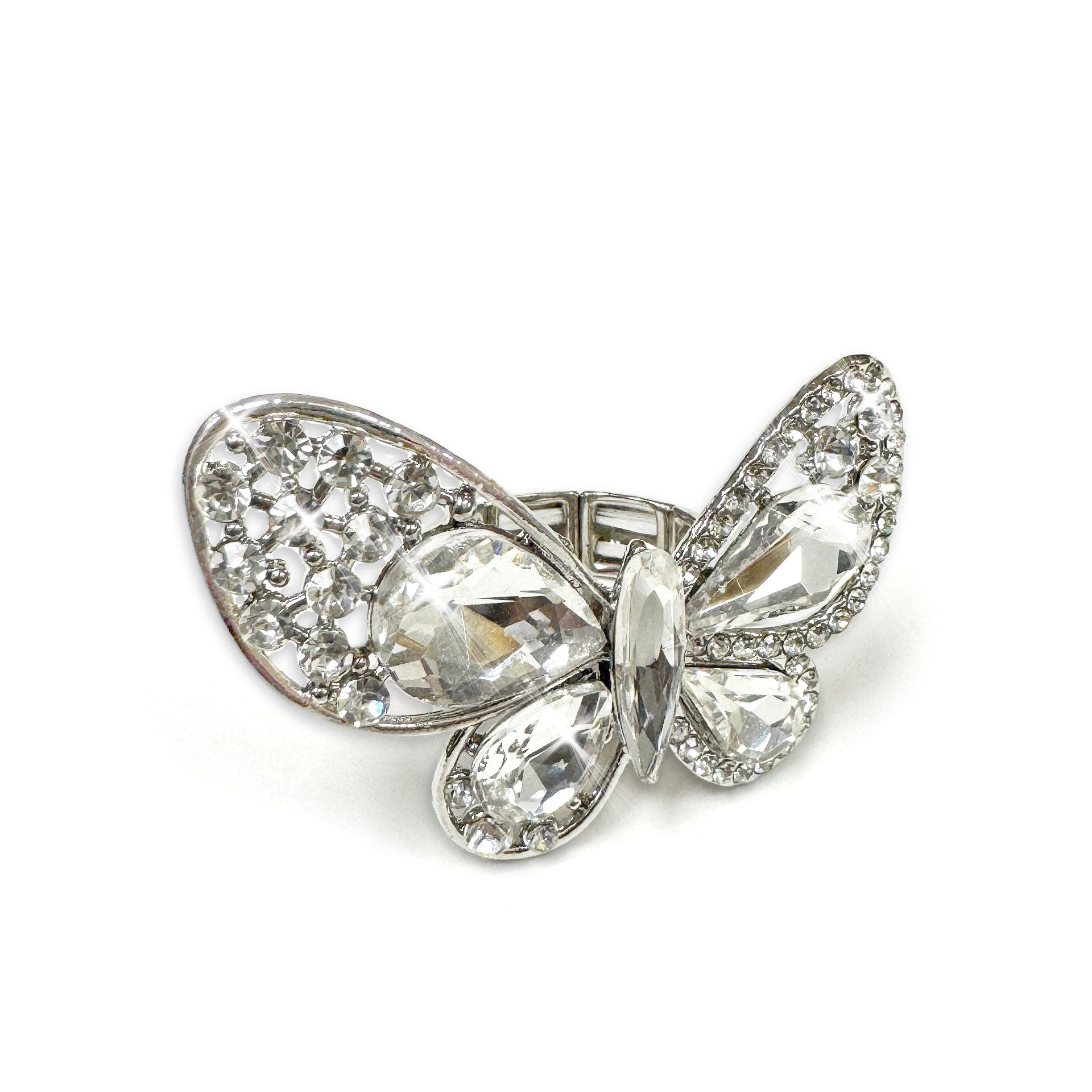 Butterfly-shaped ring with crystal details on a white background