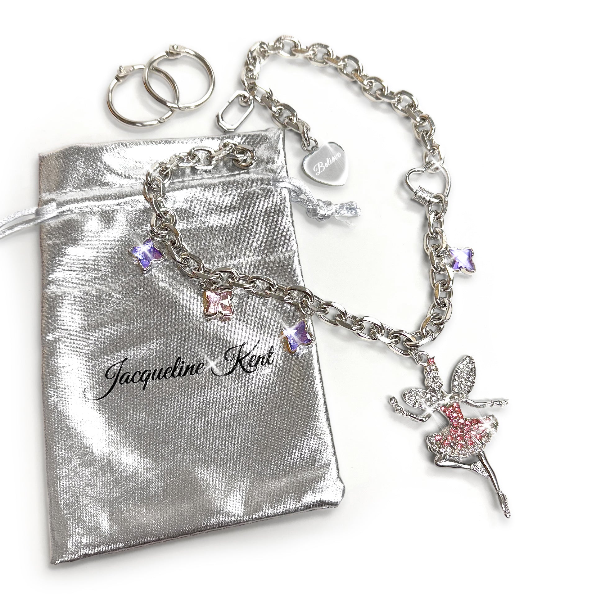 Silver bracelet with fairy charm on a silver pouch, featuring the brand 'Jacqueline Kent'.