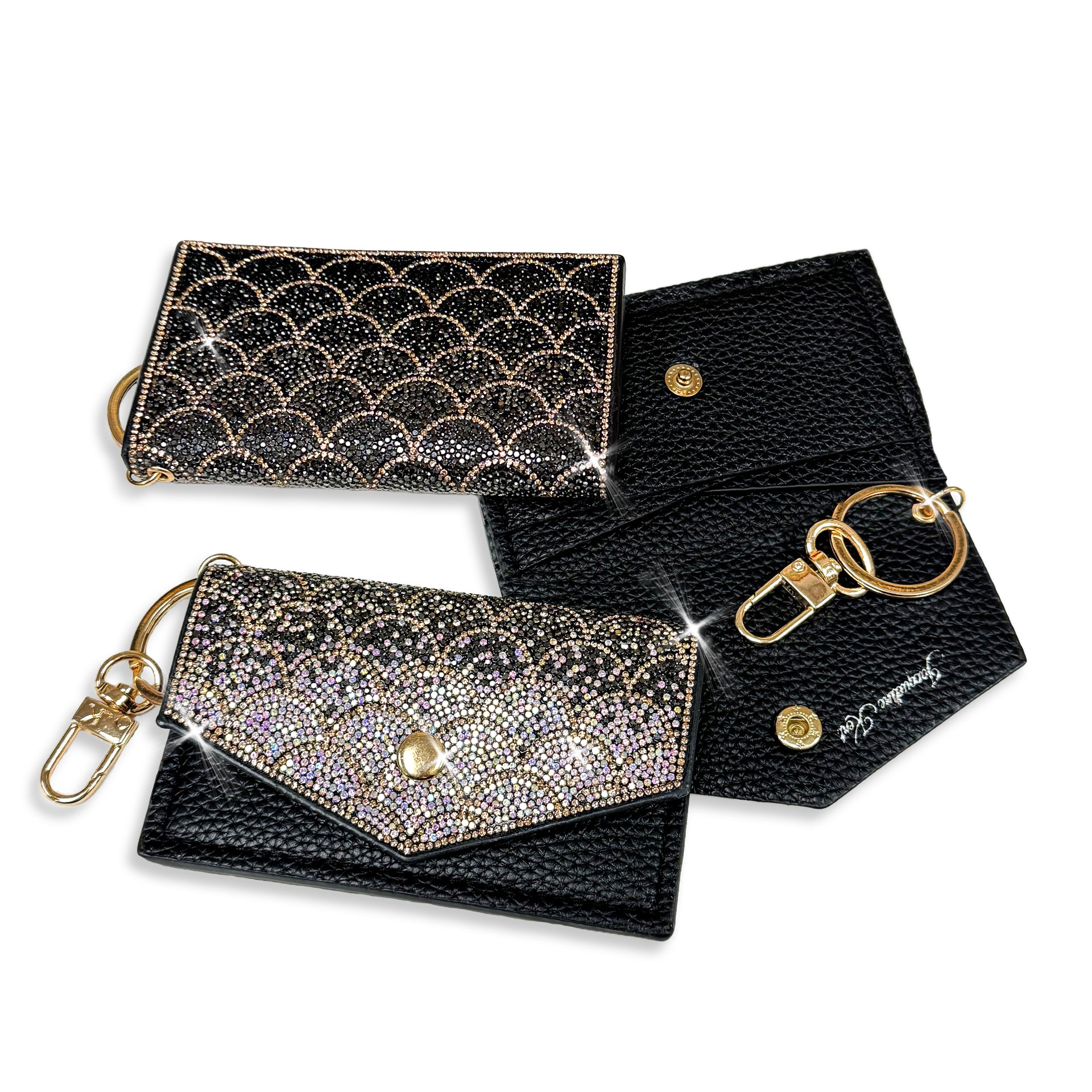 Mermaid scale patterned faux leather card wallet with black, hematite, iridescent AB and gold rhinestone detailed embellishments with keychain attachment on a white background