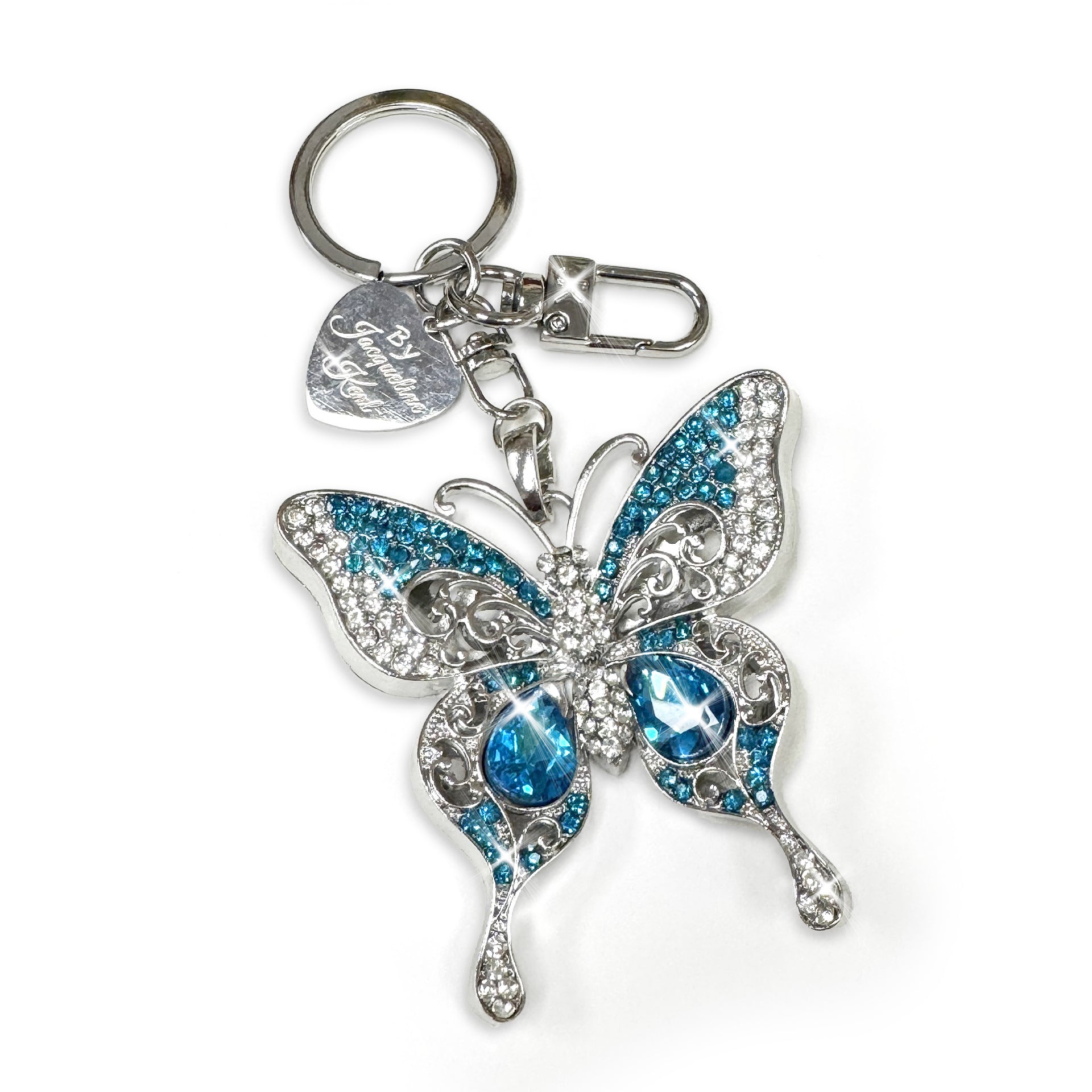 Silver butterfly purse charm with turquoise and clear white rhinestones on a white background