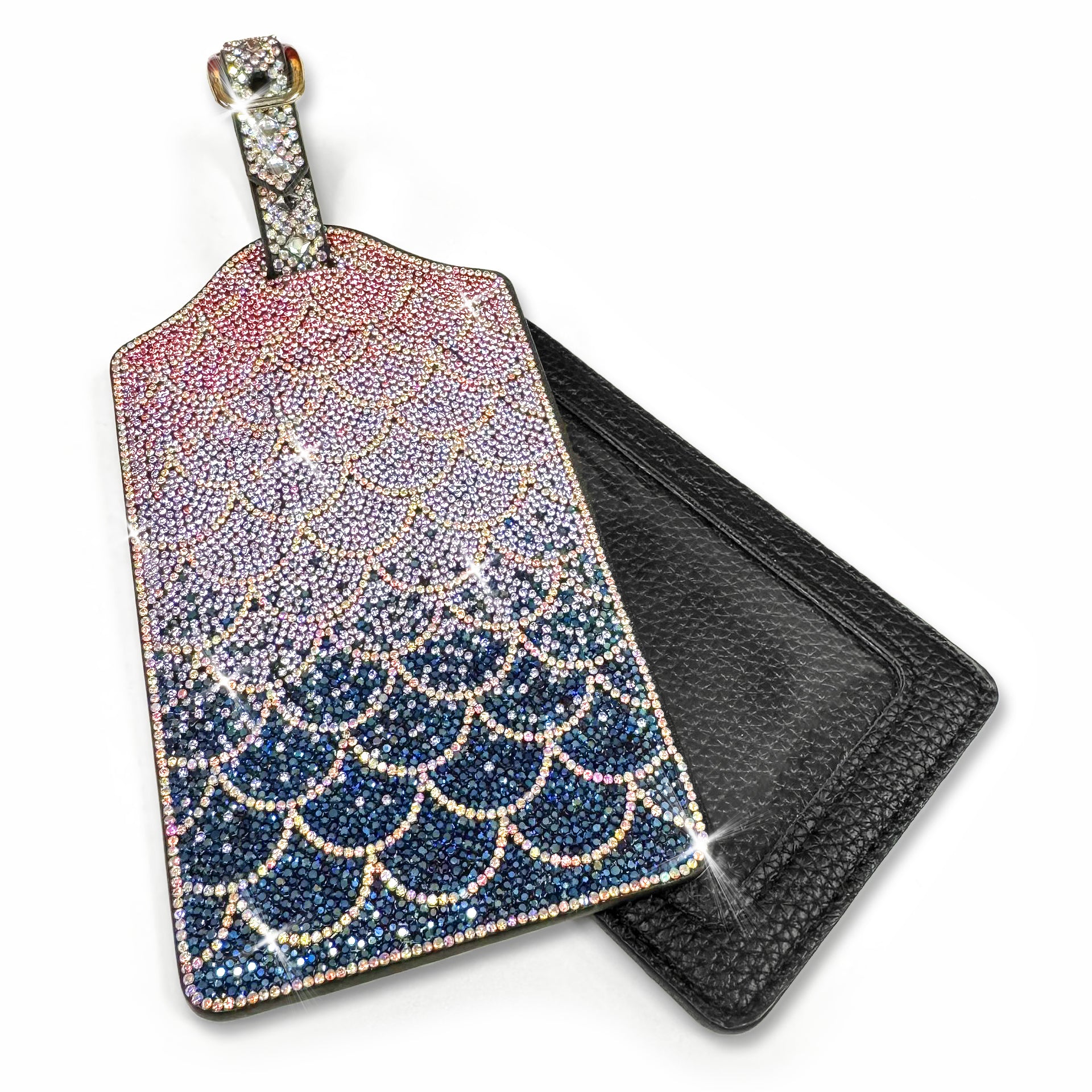 Decorative luggage tag with navy, silver and pink rhinestone mermaid scale design on a white background
