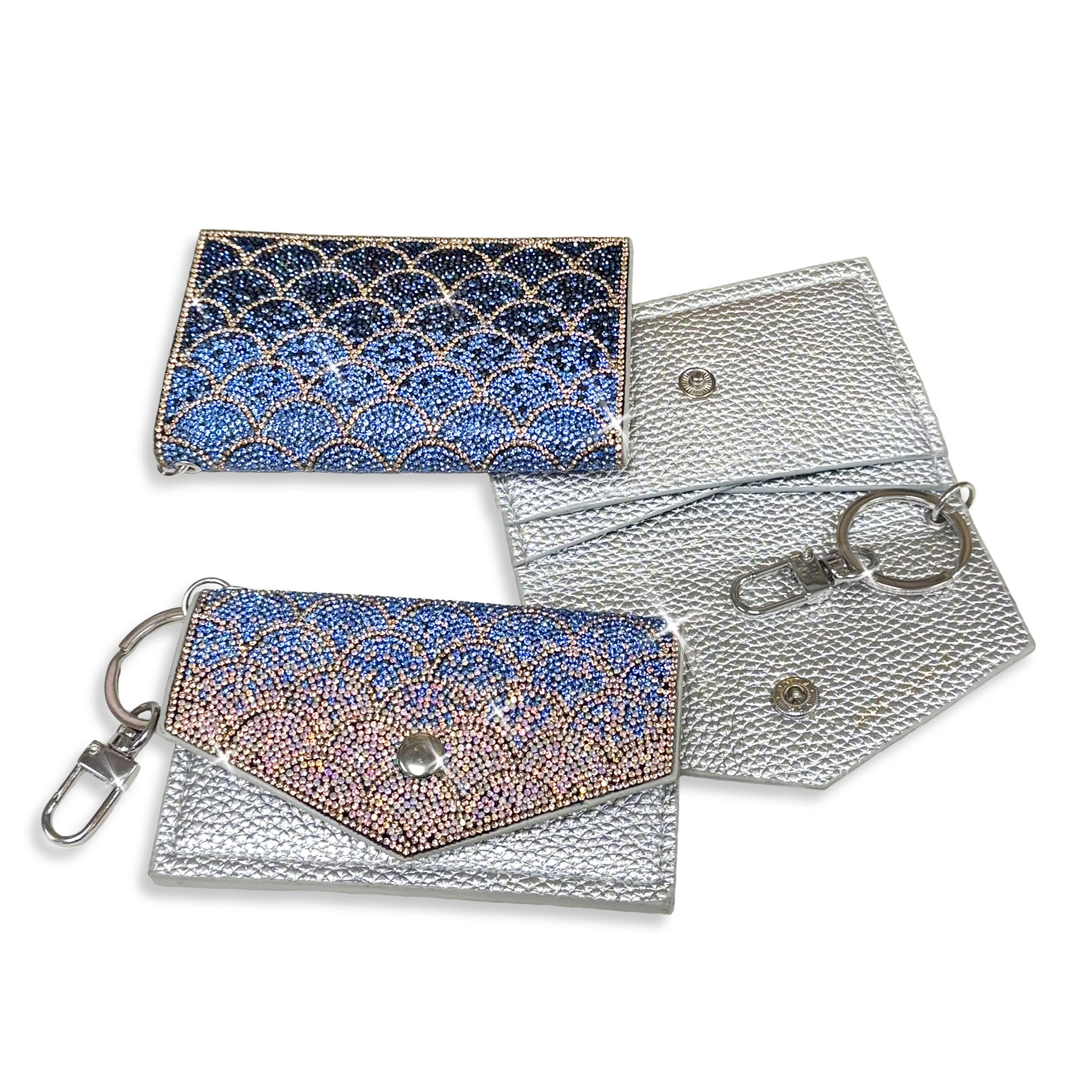 Silver faux leather card wallet, flat lay showing front, back and inside with navy, blue and pink ombre mermaid scale pattern with gold crystal details on a white background