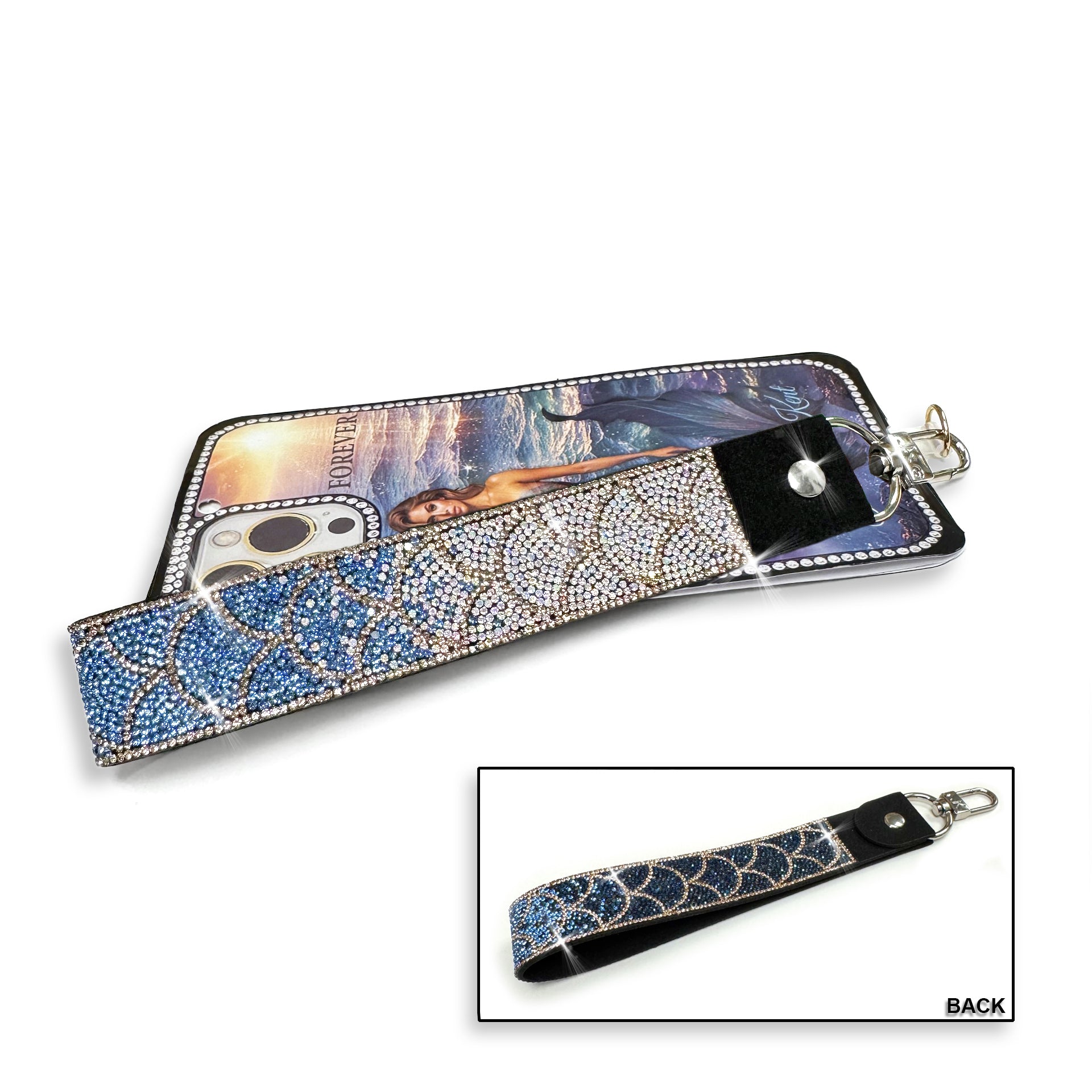 Phone/wrist lanyard mermaid scale pattern with navy, blue and silver rhinestones and gold crystal details on a white background
