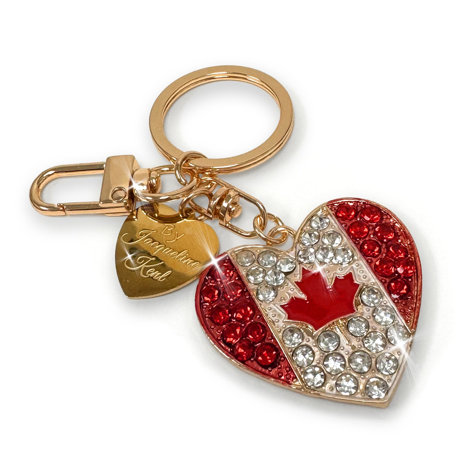 Keychain with heart-shaped Canadian flag charm and gold clasp on a white background