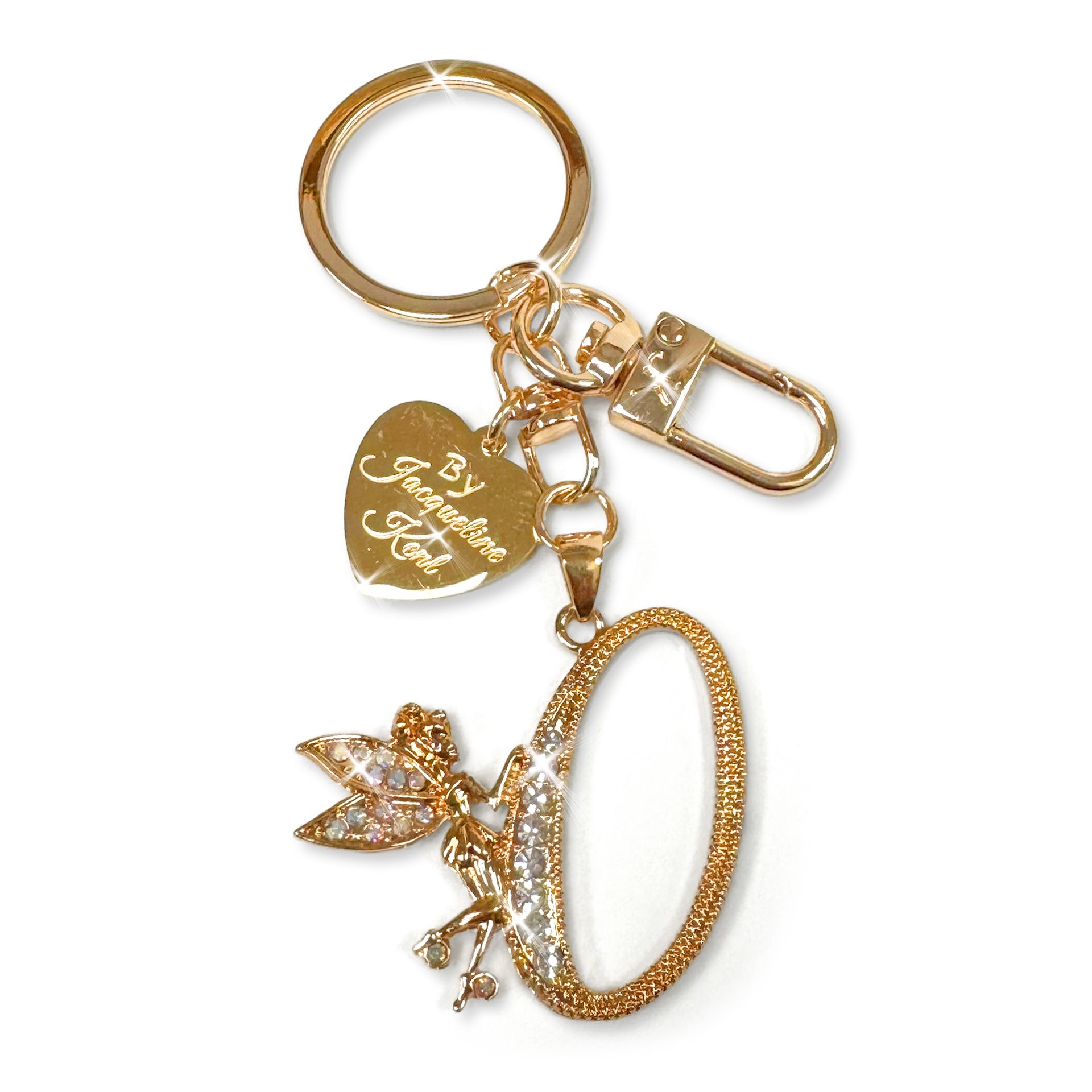 Gold and crystal embellished keychain with decorative letter 'O' and heart-shaped Jacqueline Kent branded tag on a white background