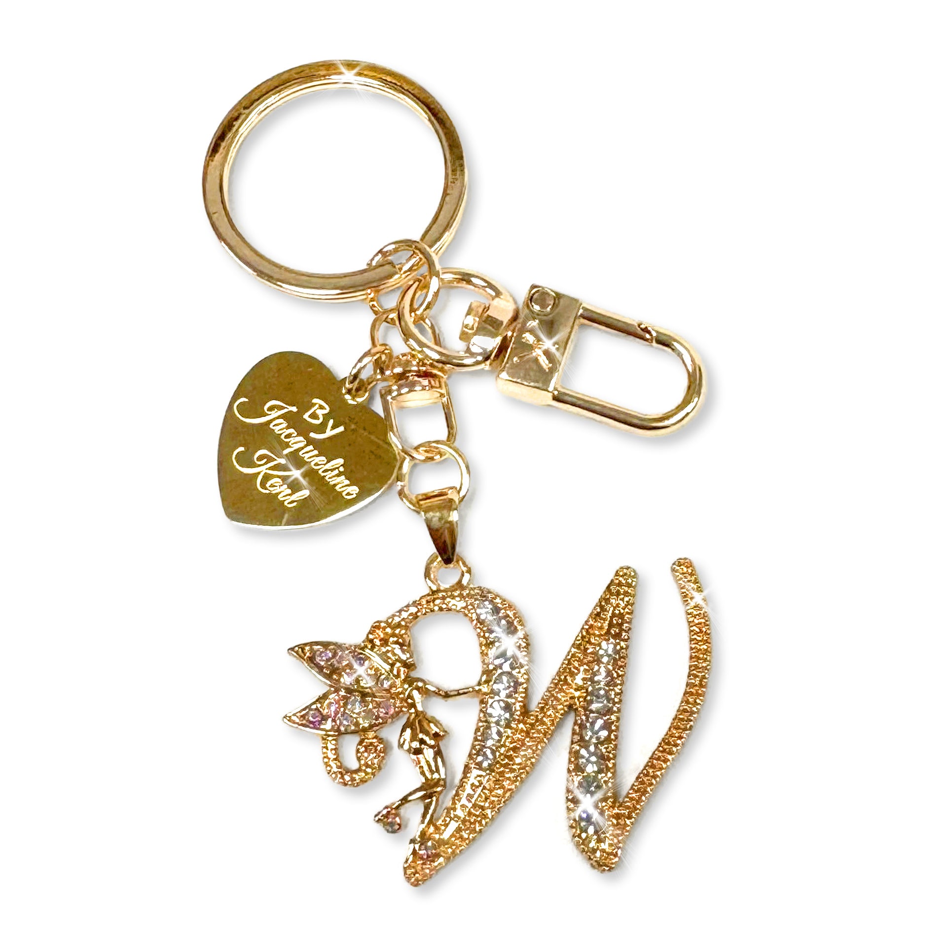 Gold and crystal embellished keychain with decorative letter 'W' and heart-shaped Jacqueline Kent branded tag on a white background