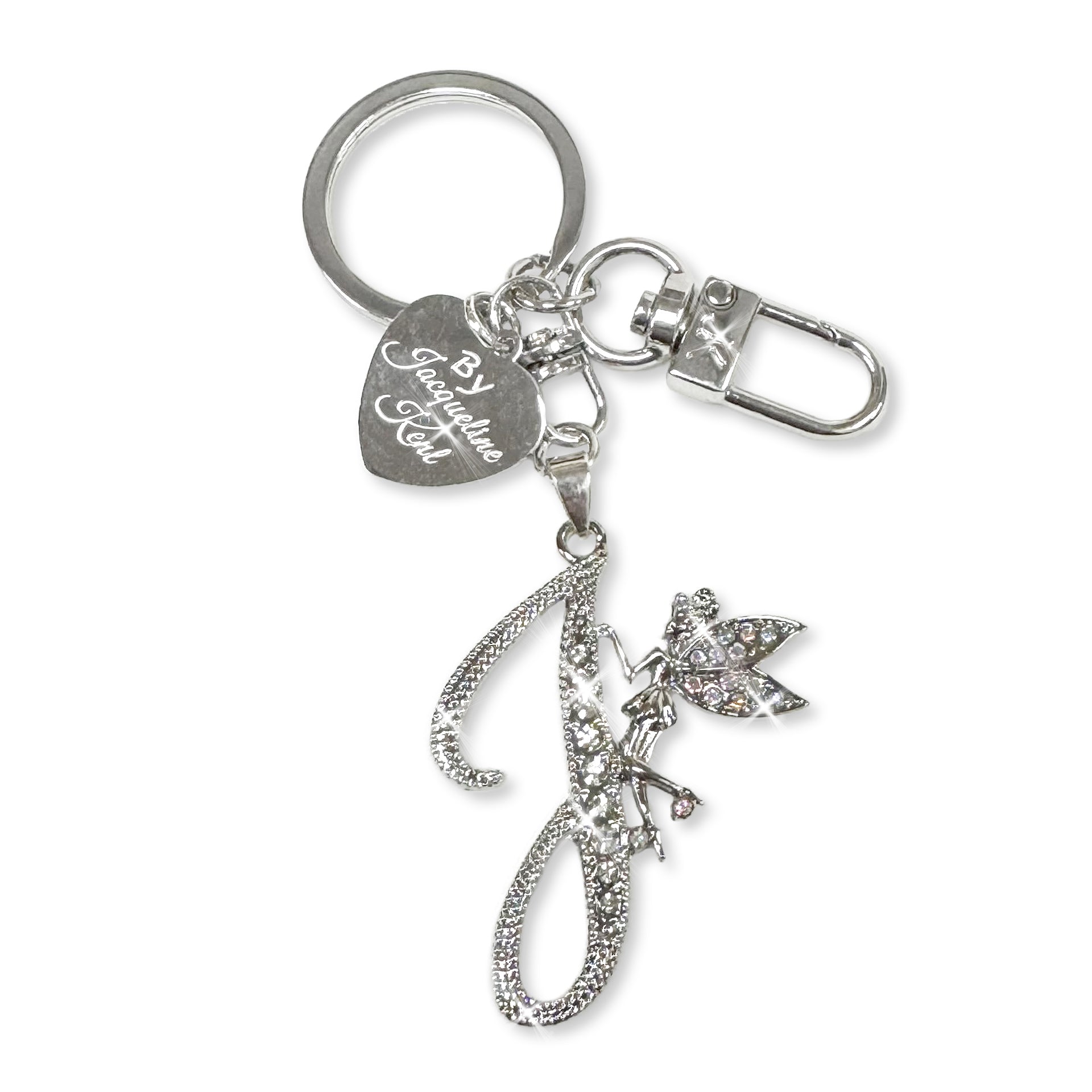 Silver and crystal embellished keychain with decorative letter 'J' and heart-shaped Jacqueline Kent branded tag on a white background