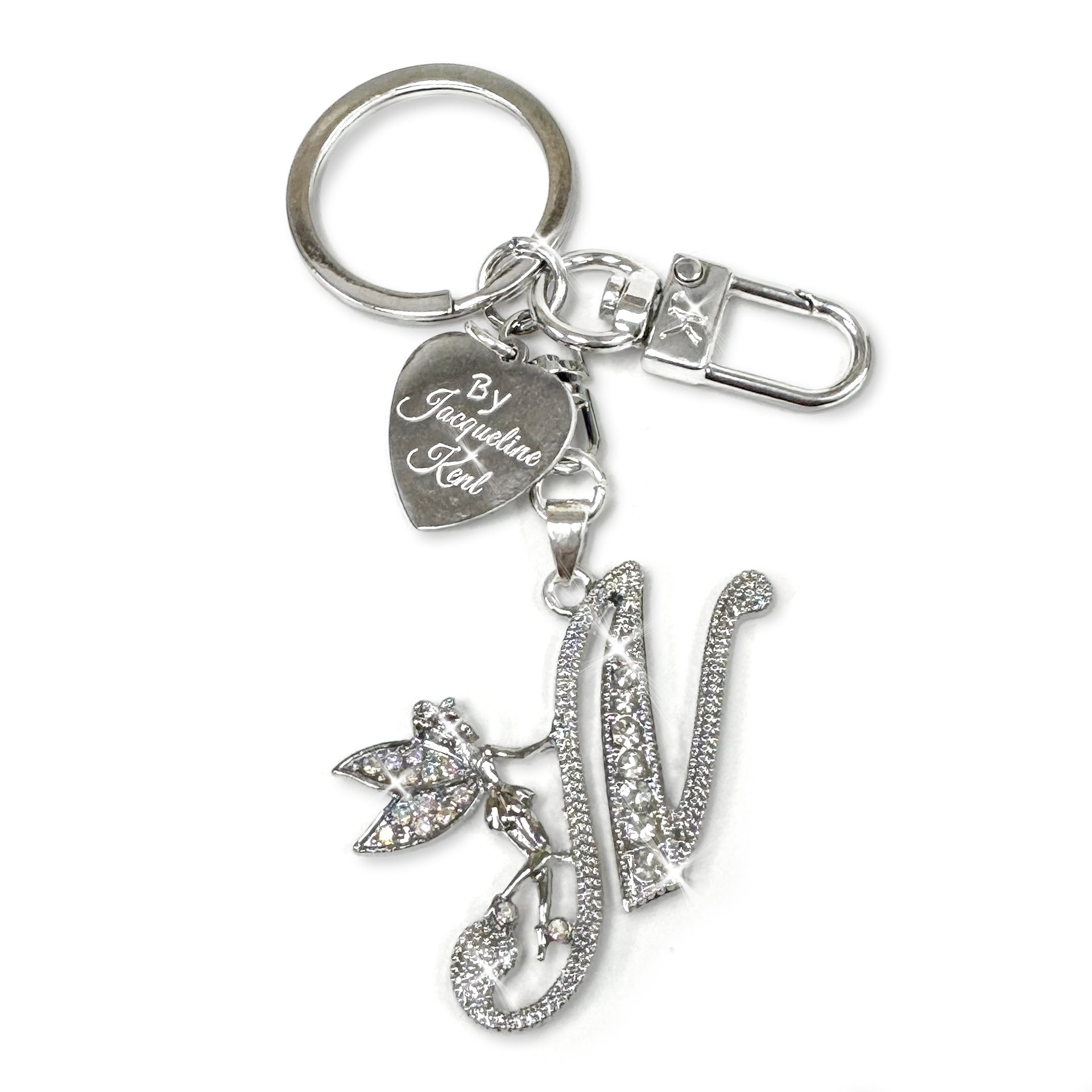 Silver and crystal embellished keychain with decorative letter 'N' and heart-shaped Jacqueline Kent branded tag on a white background