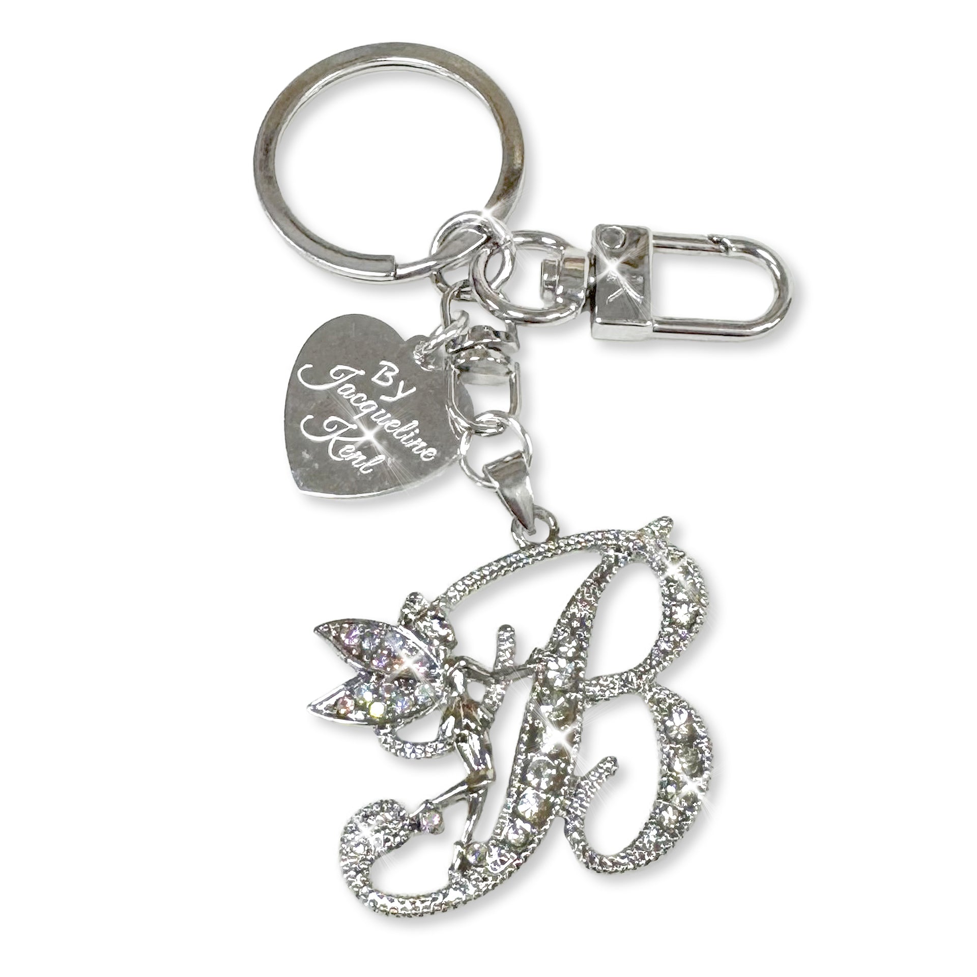 Silver and crystal embellished keychain with decorative letter 'B' and heart-shaped Jacqueline Kent branded tag on a white background