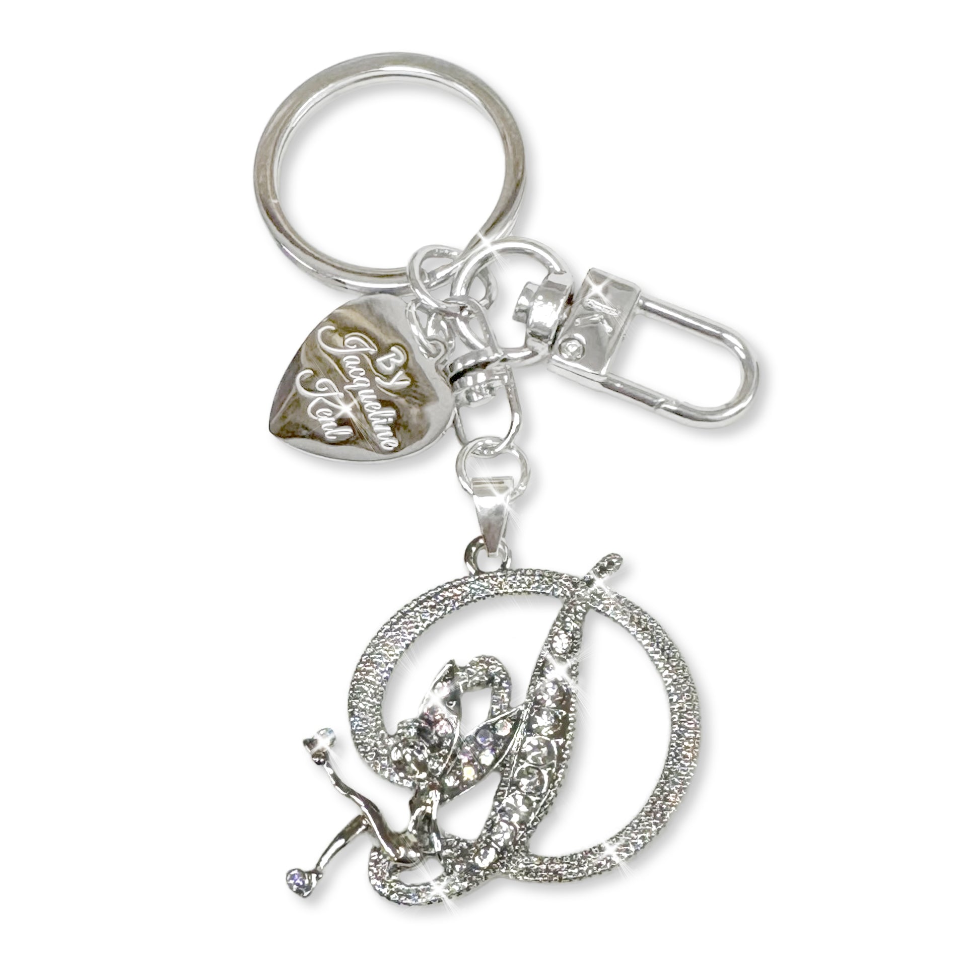 Silver and crystal embellished keychain with decorative letter 'D' and heart-shaped Jacqueline Kent branded tag on a white background