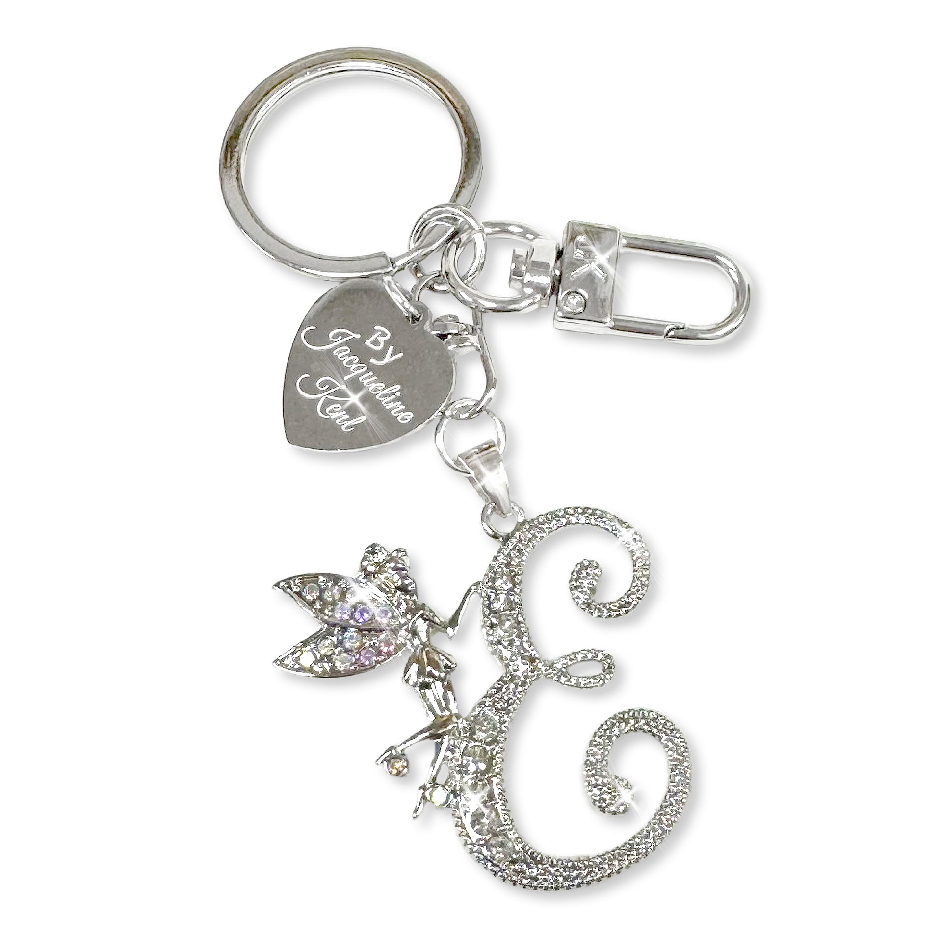 Silver and crystal embellished keychain with decorative letter 'E' and heart-shaped Jacqueline Kent branded tag on a white background