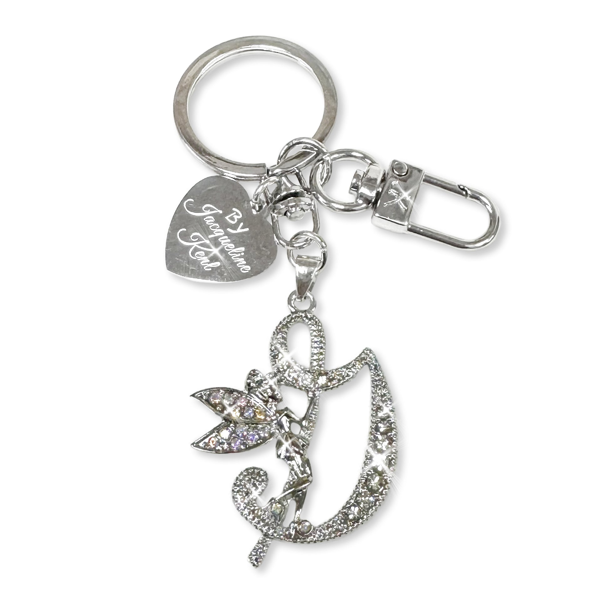Silver and crystal embellished keychain with decorative letter 'G' and heart-shaped Jacqueline Kent branded tag on a white background