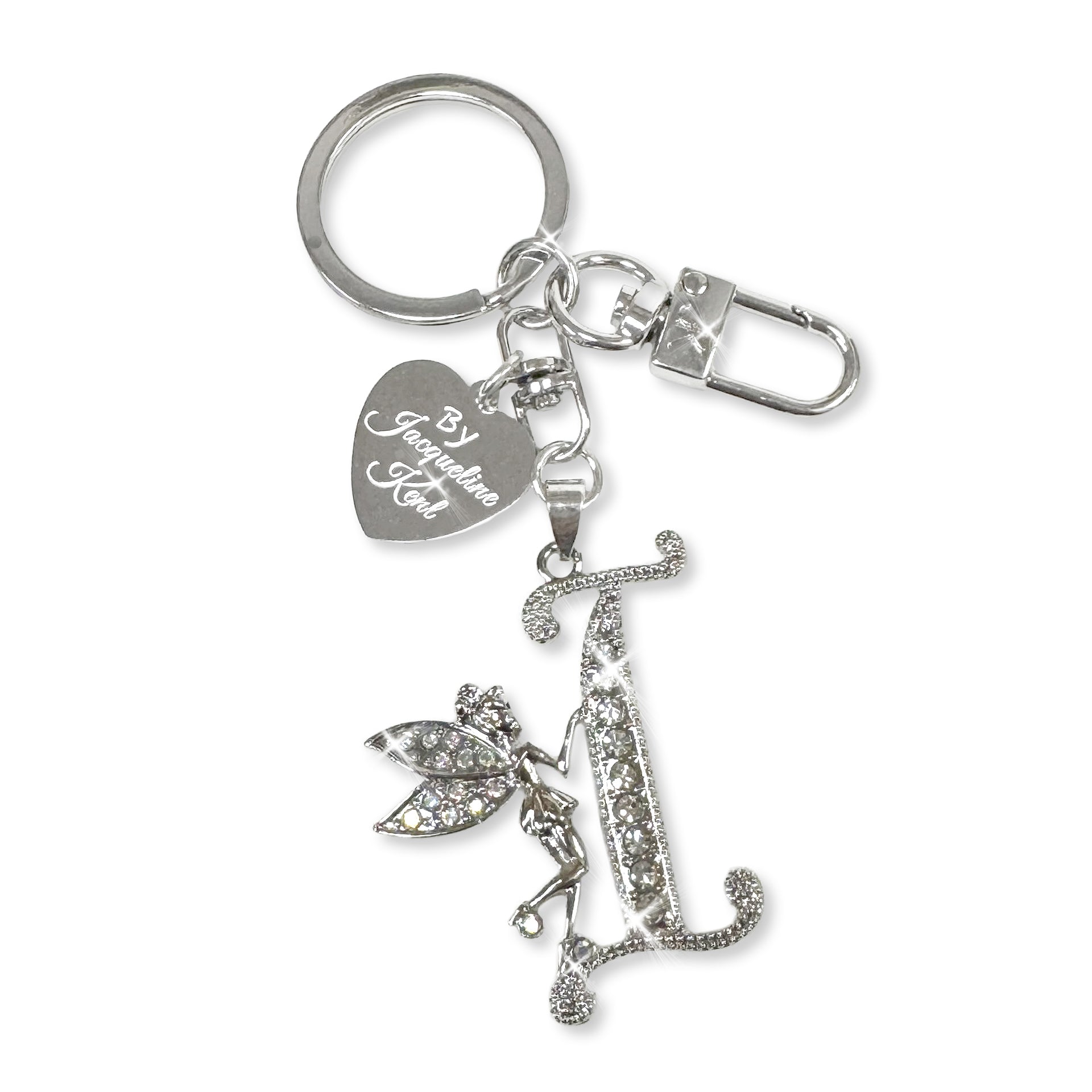 Silver and crystal embellished keychain with decorative letter 'I' and heart-shaped Jacqueline Kent branded tag on a white background