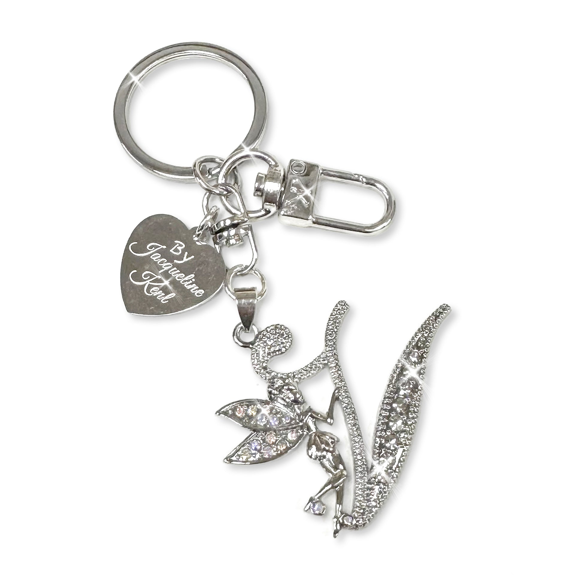 Silver and crystal embellished keychain with decorative letter 'V' and heart-shaped Jacqueline Kent branded tag on a white background