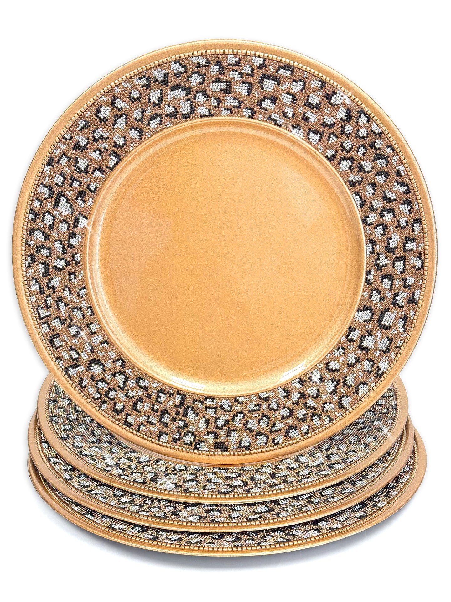 A stack of round decorative charger plates in gold with leopard crystal rhinestones glitter pattern, set against a plain white background.