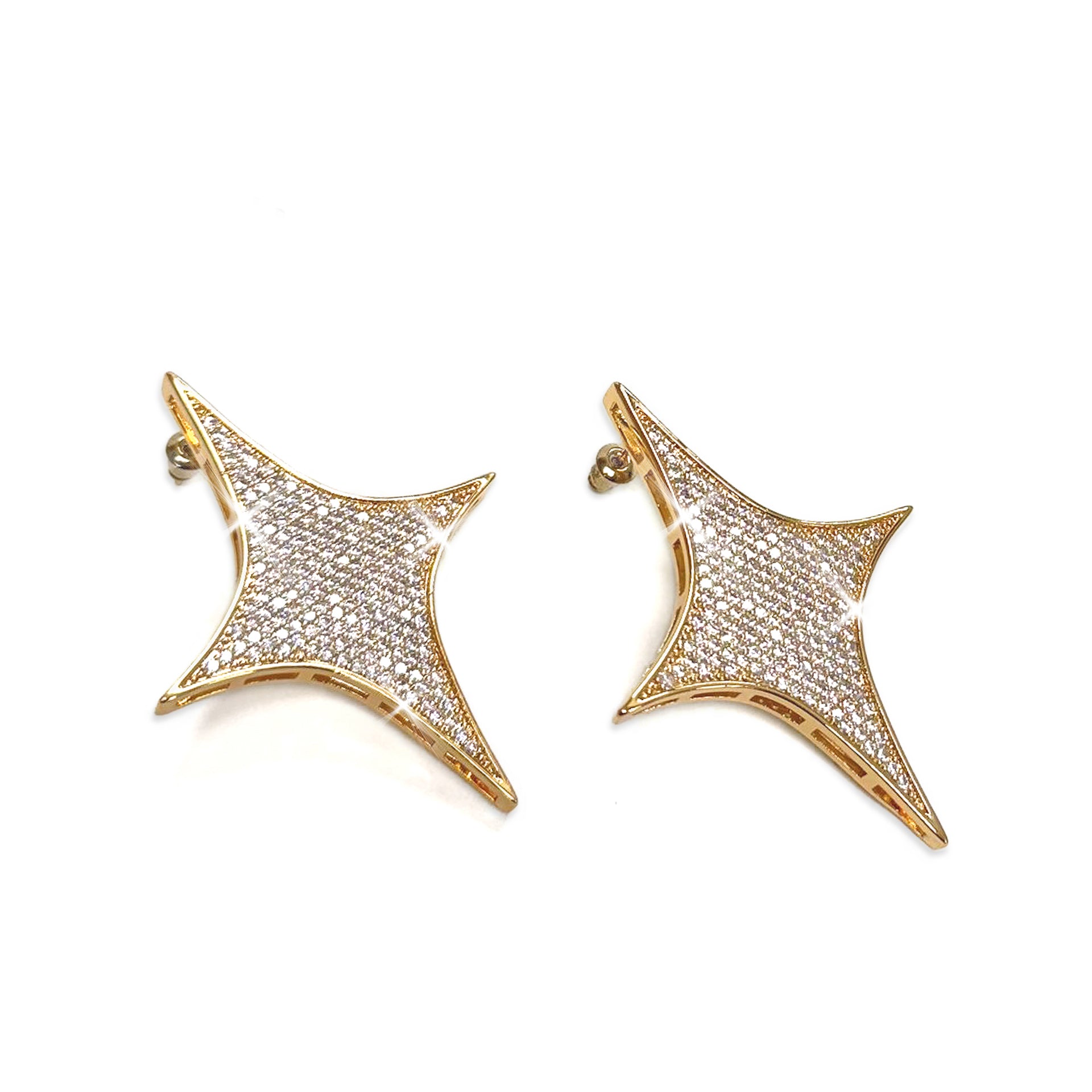 Gold star-shaped earrings with clear rhinestones on a white background