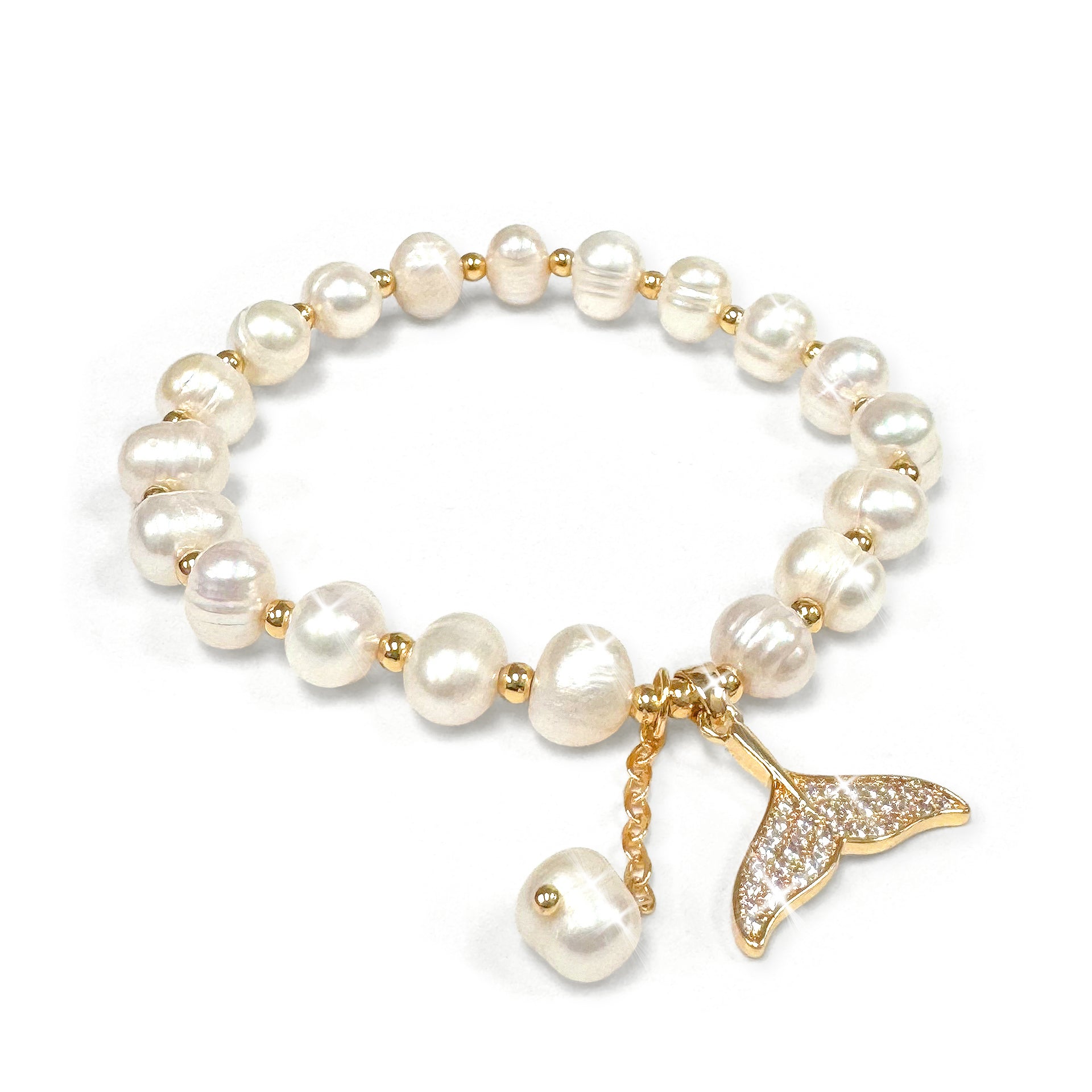 Pearl bracelet with a mermaid tail charm encrusted with clear rhinestones on a white background