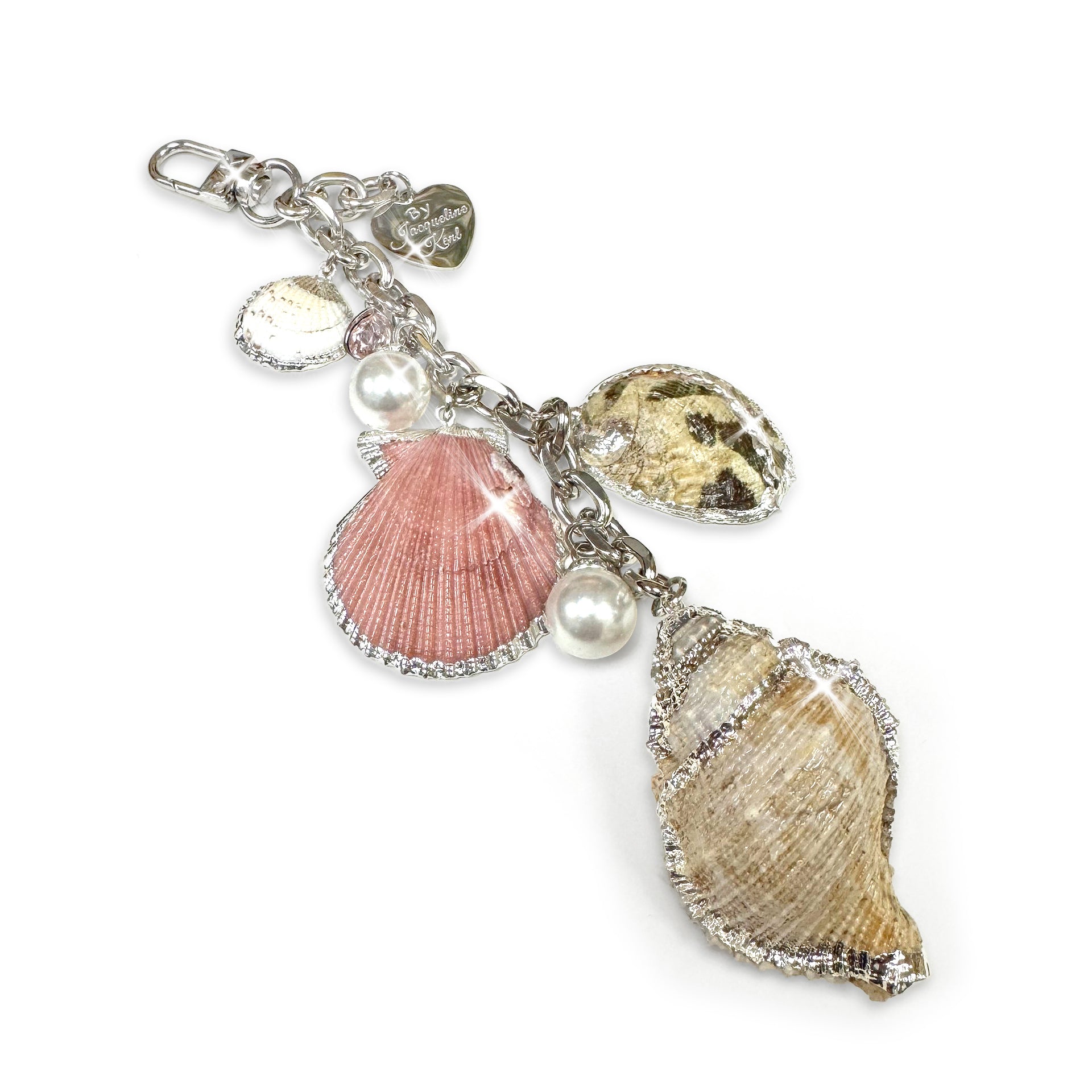 Decorative keychain with shell and pearl charms on a white background