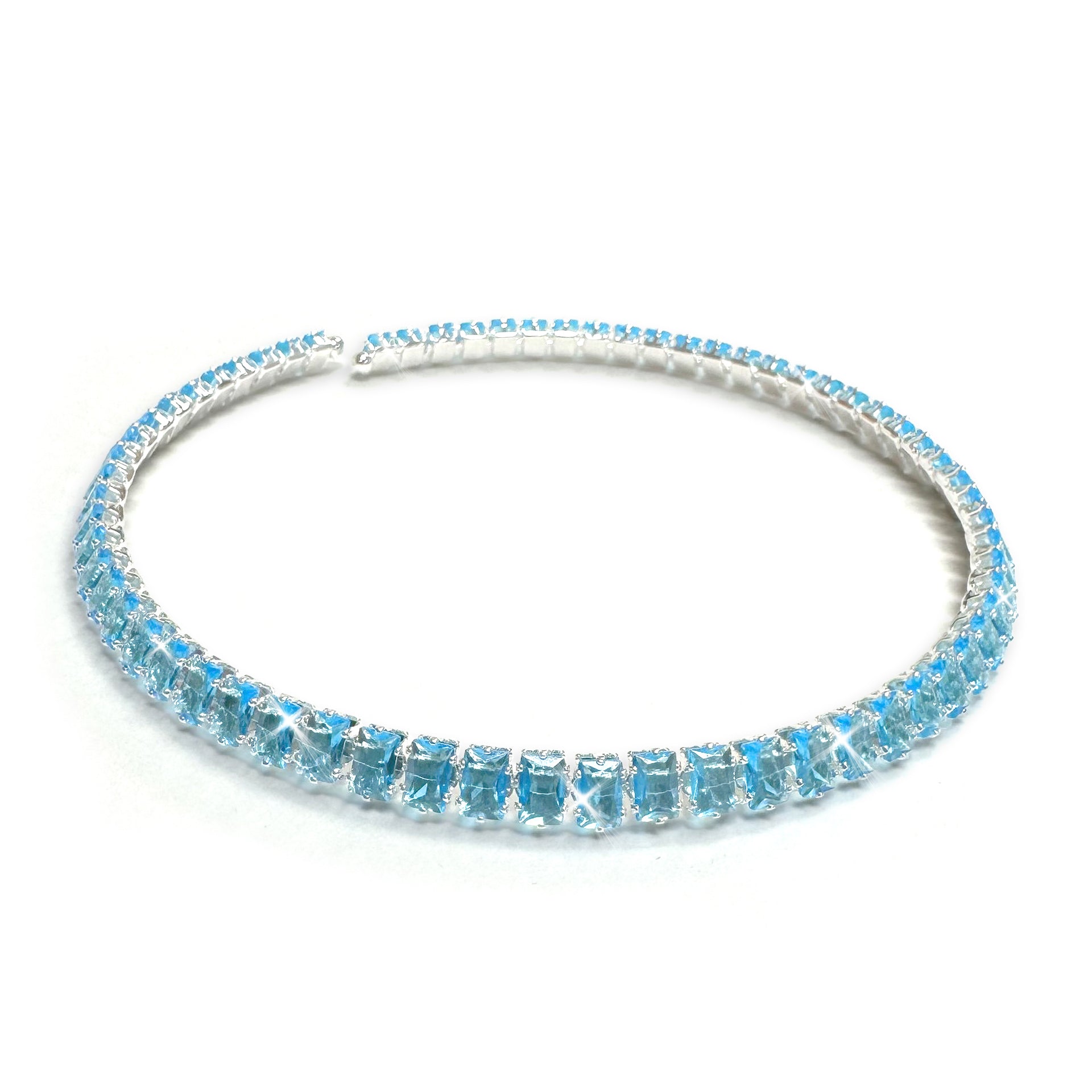 Silver necklace with turquoise crystals on a white background