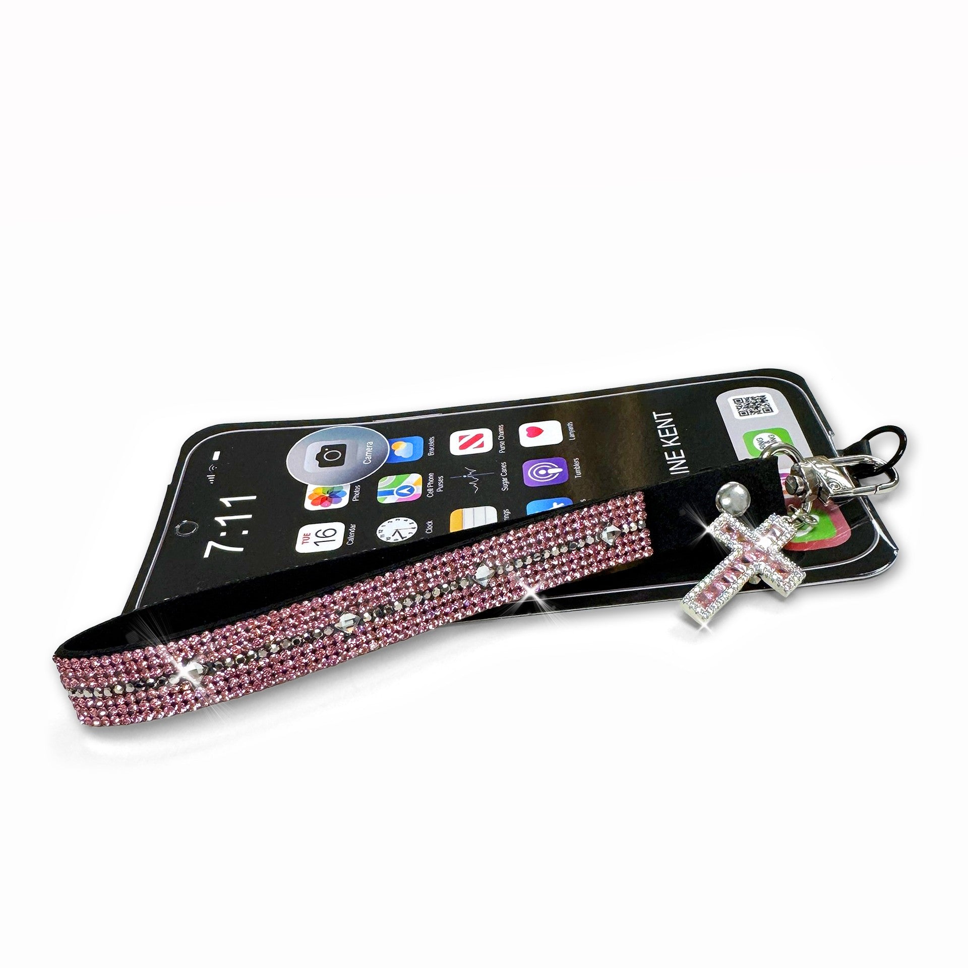 Phone case with pink and clear rhinestone bling and cross charm on a white background