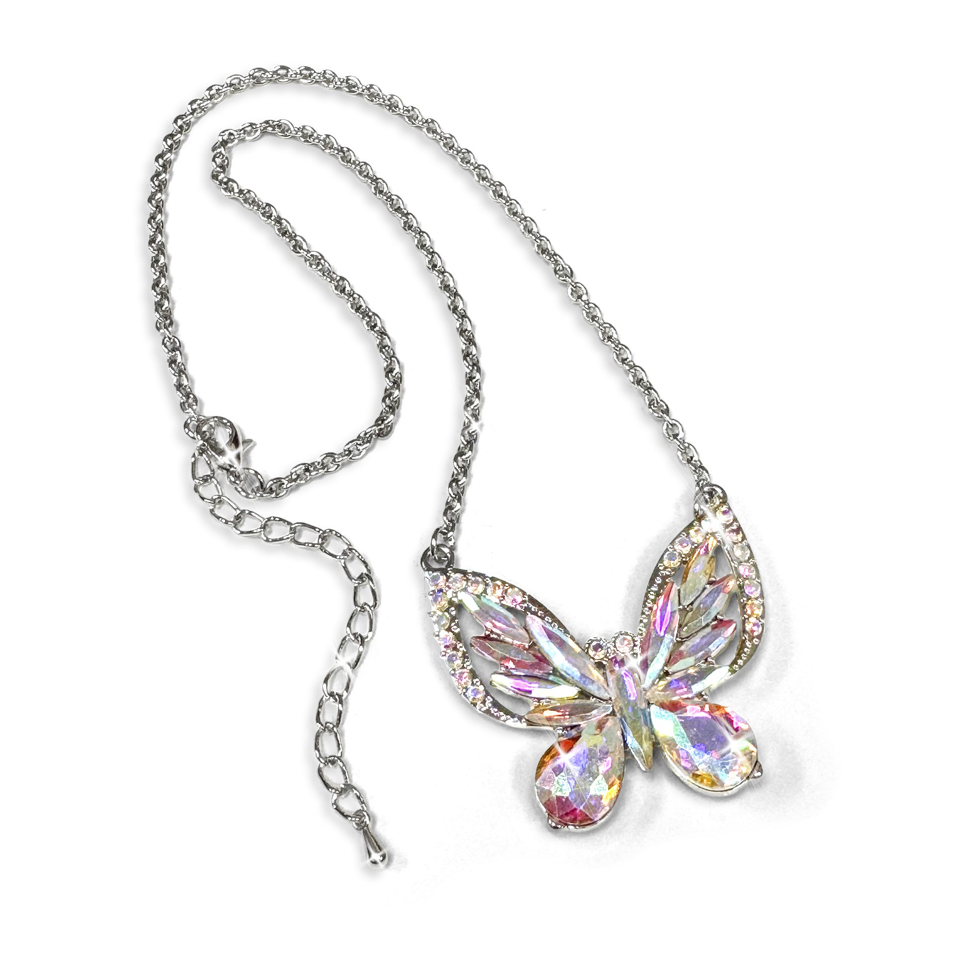 Butterfly-shaped crystal pendant on a chain against a white background