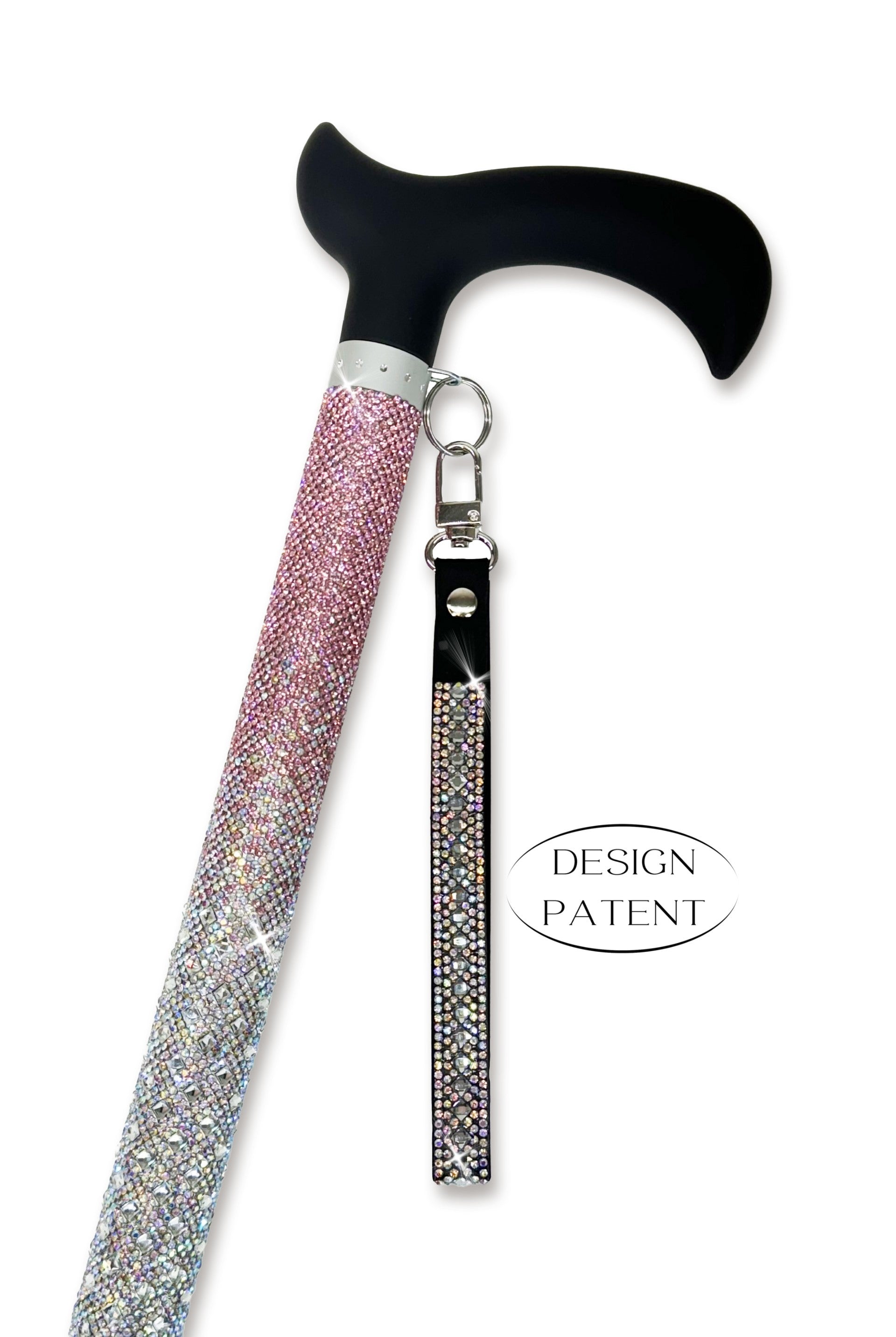Decorative walking cane with pink ombre coloured rhinestone shaft and black derby handle on a white background