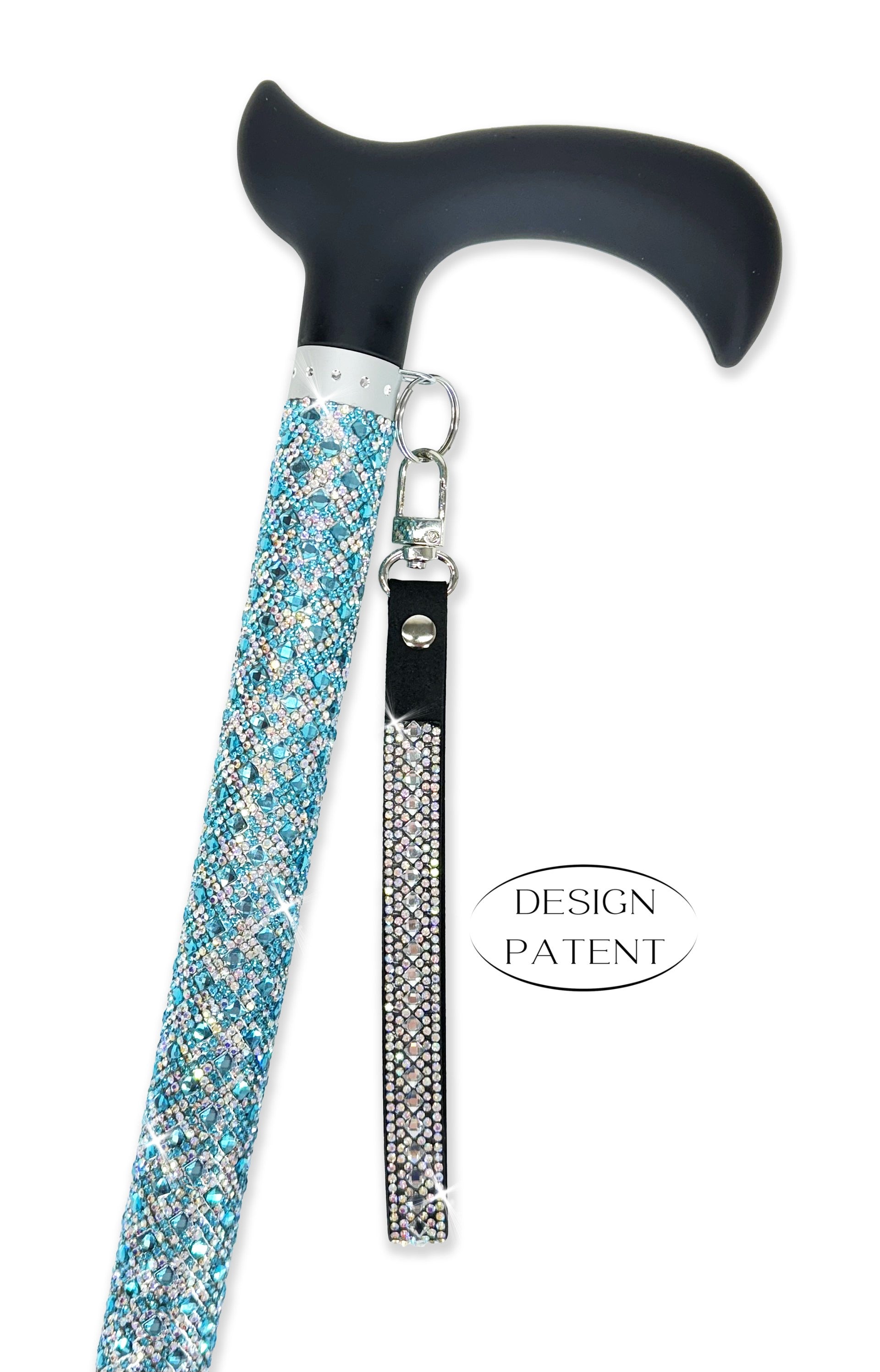 Decorative walking cane with turquoise and silver coloured rhinestone shaft and black derby handle on a white background