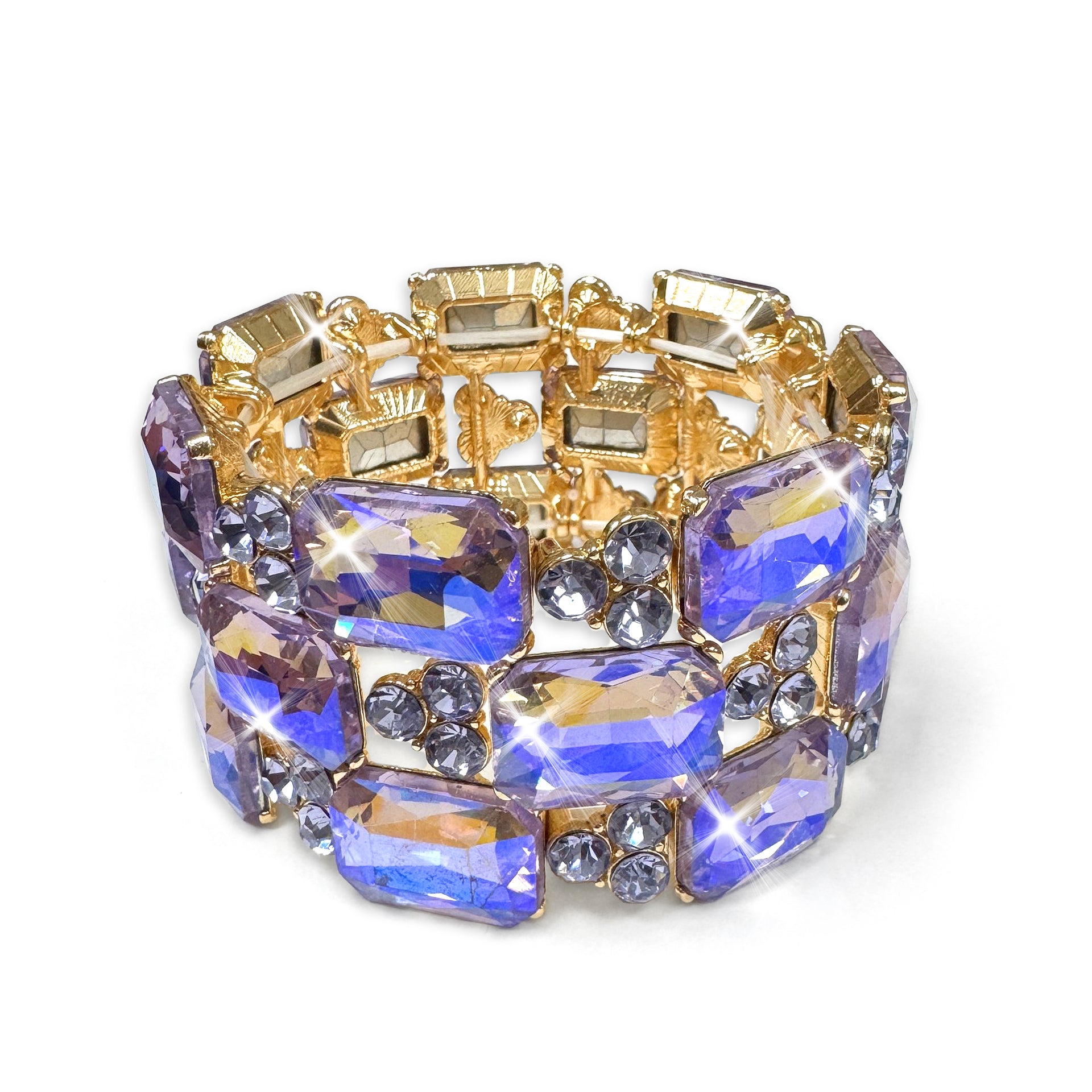 Wide cuff stretch crystal bracelet with purple and gold stones on a white background