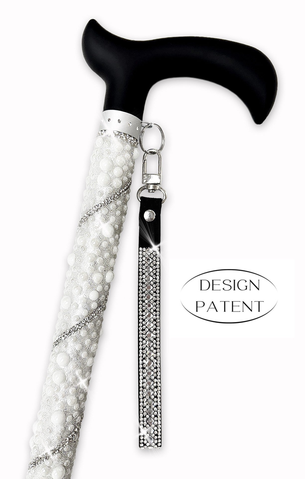 Decorative walking cane with rhinestone and pearl embellishments and tassel on a white background