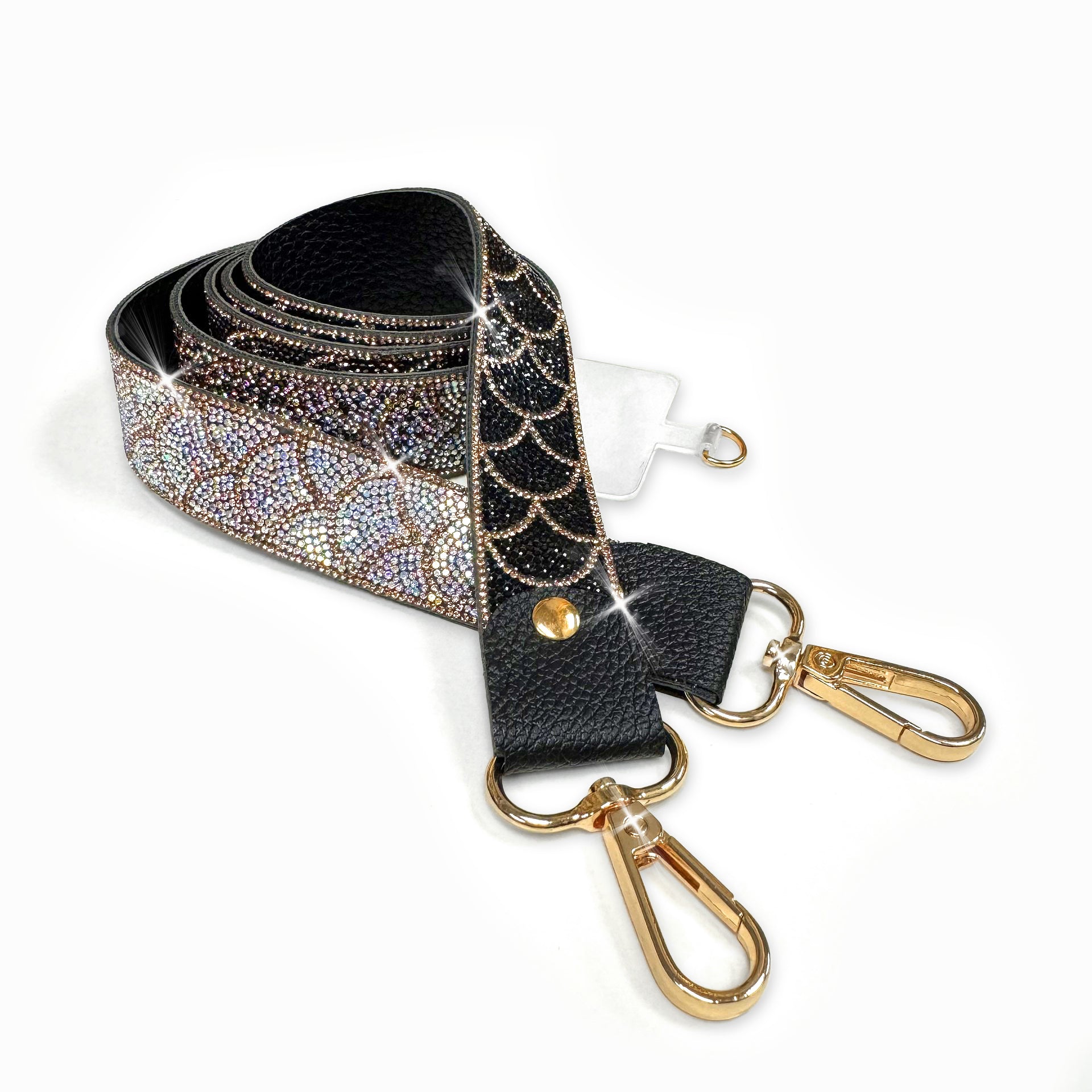 Black, hematite, iridescent AB and gold rhinestone mermaid scale patterned strap with gold hardware on a white background