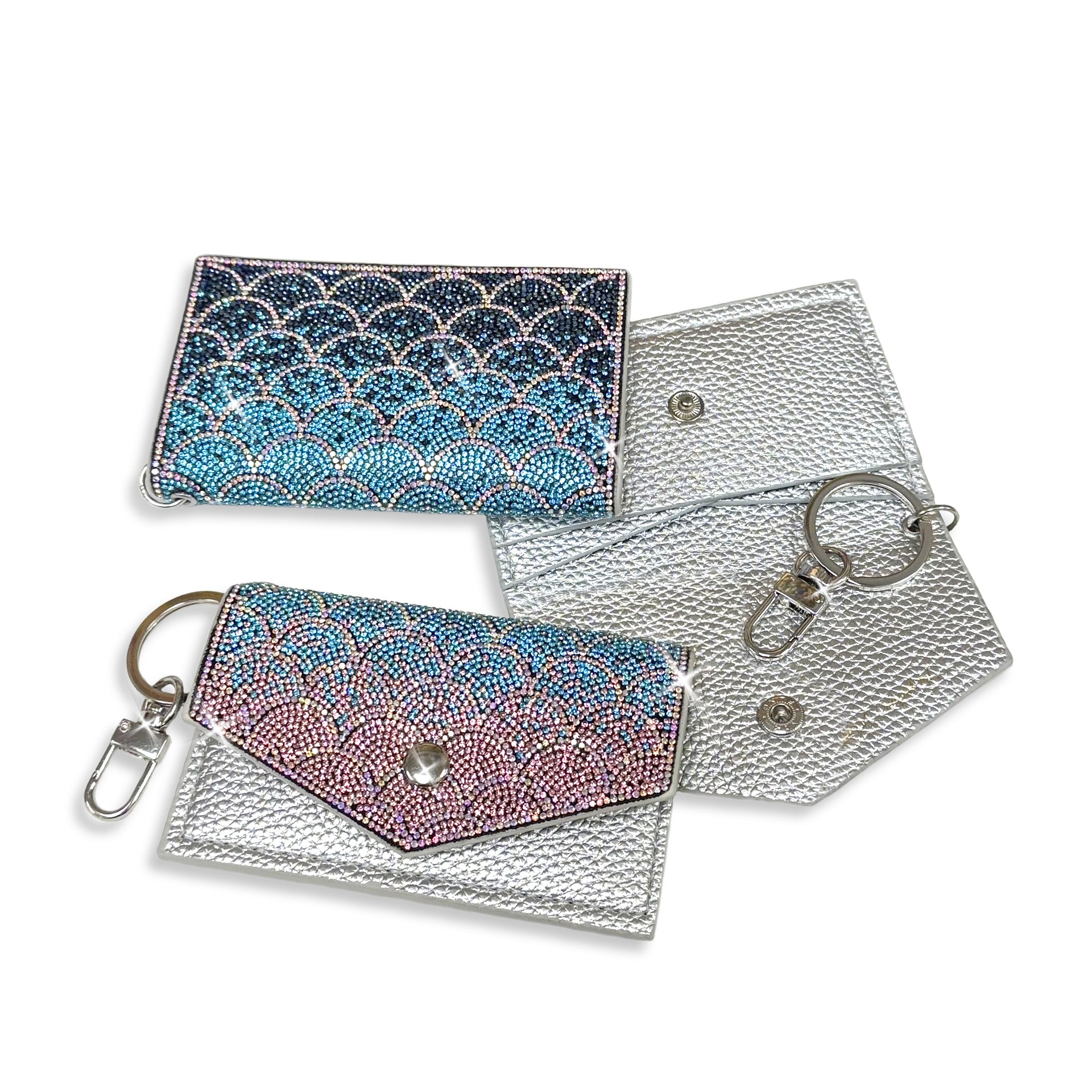 Mermaid scale patterned faux silver card wallet in pink, blue and navy rhinestones and silver crystal accents with  keychain attachment. Image displaying front back and open wallet.