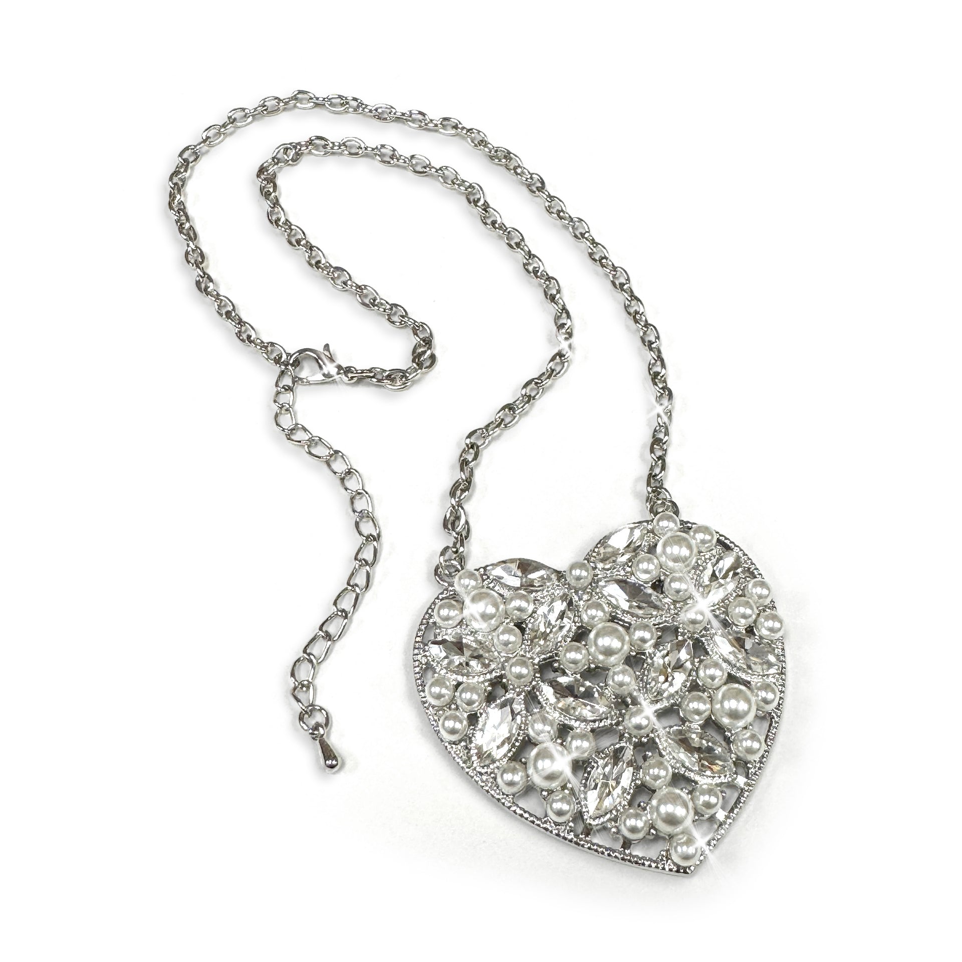 Heart-shaped necklace with pearls and crystals on a white background
