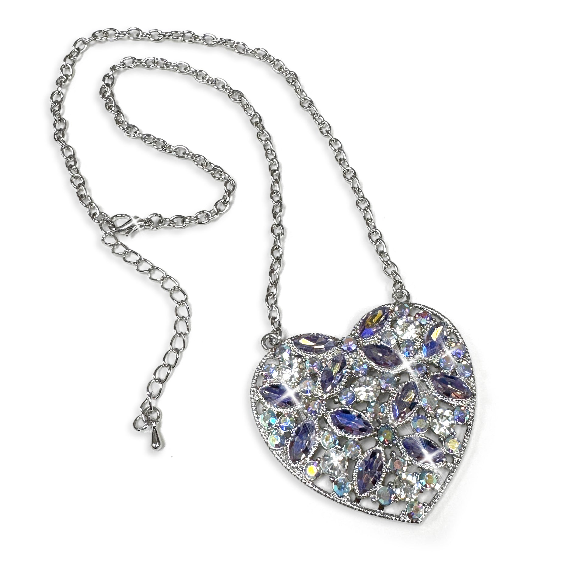 Heart-shaped silver necklace with purple and Ab crystals on a white background