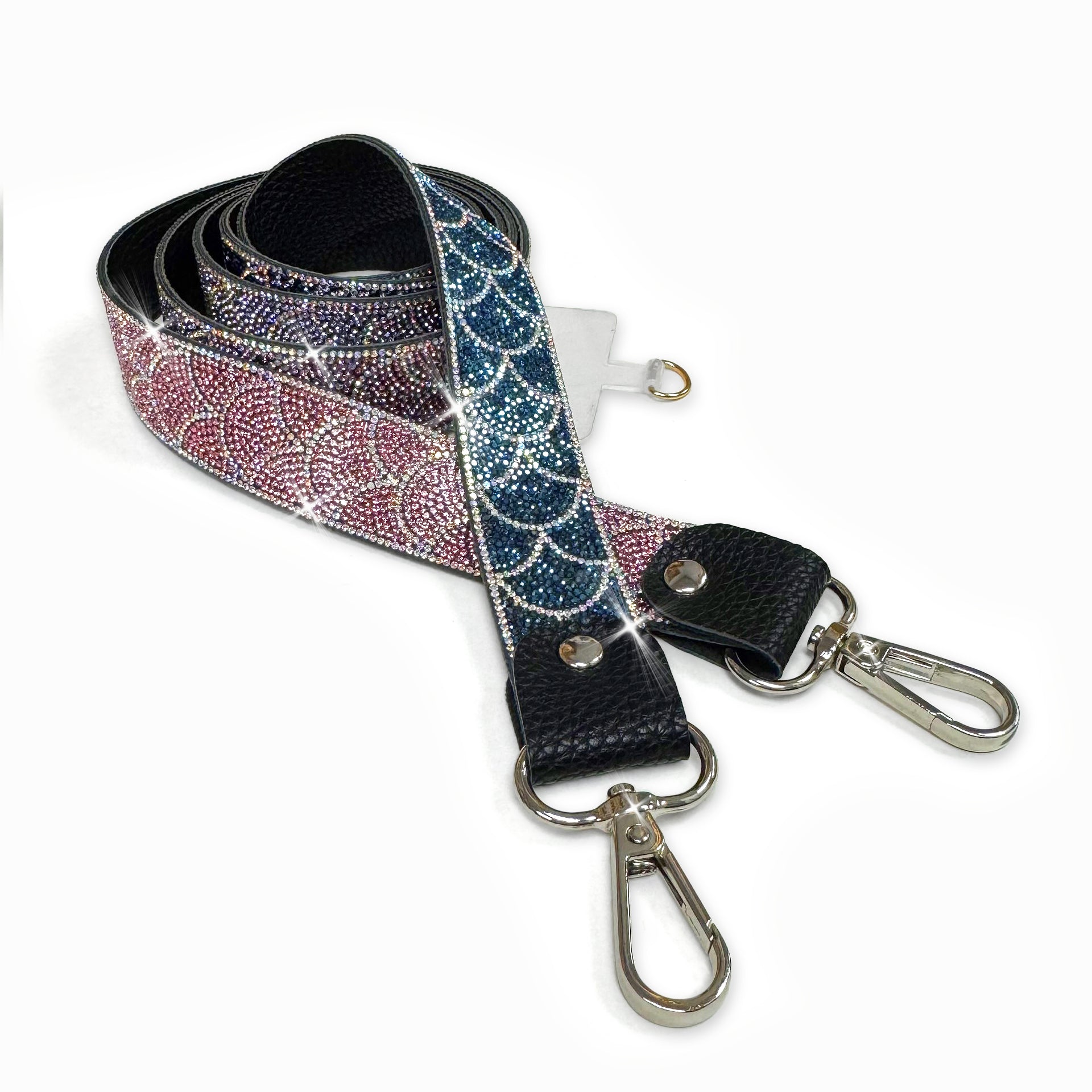 Decorative mermaid scale pattern phone lanyard with navy, lavender, and pink ombre with silver rhinestone detail on a white background